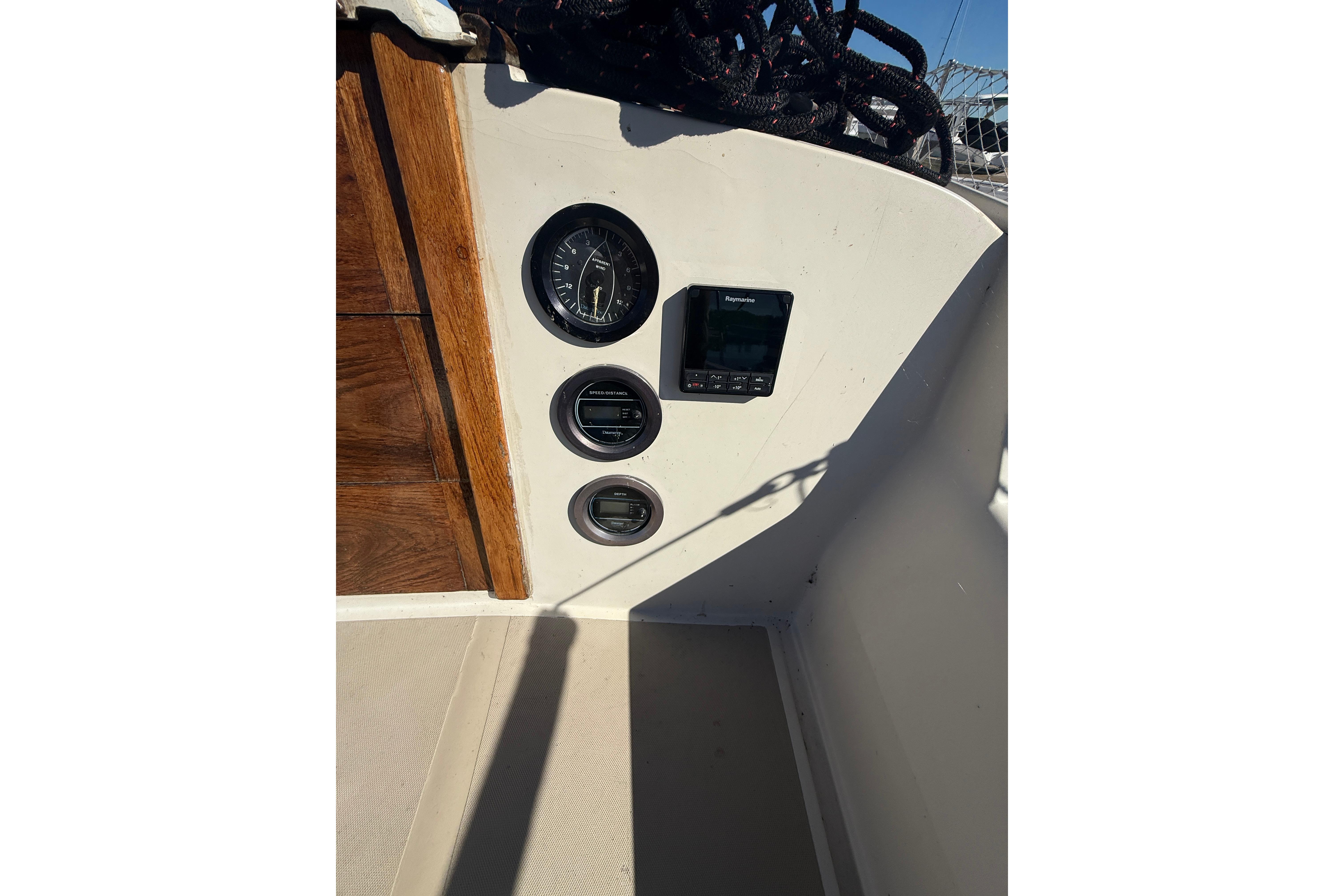 1983 O'Day 34 sailboat cockpit with gauges and navigation equipment.