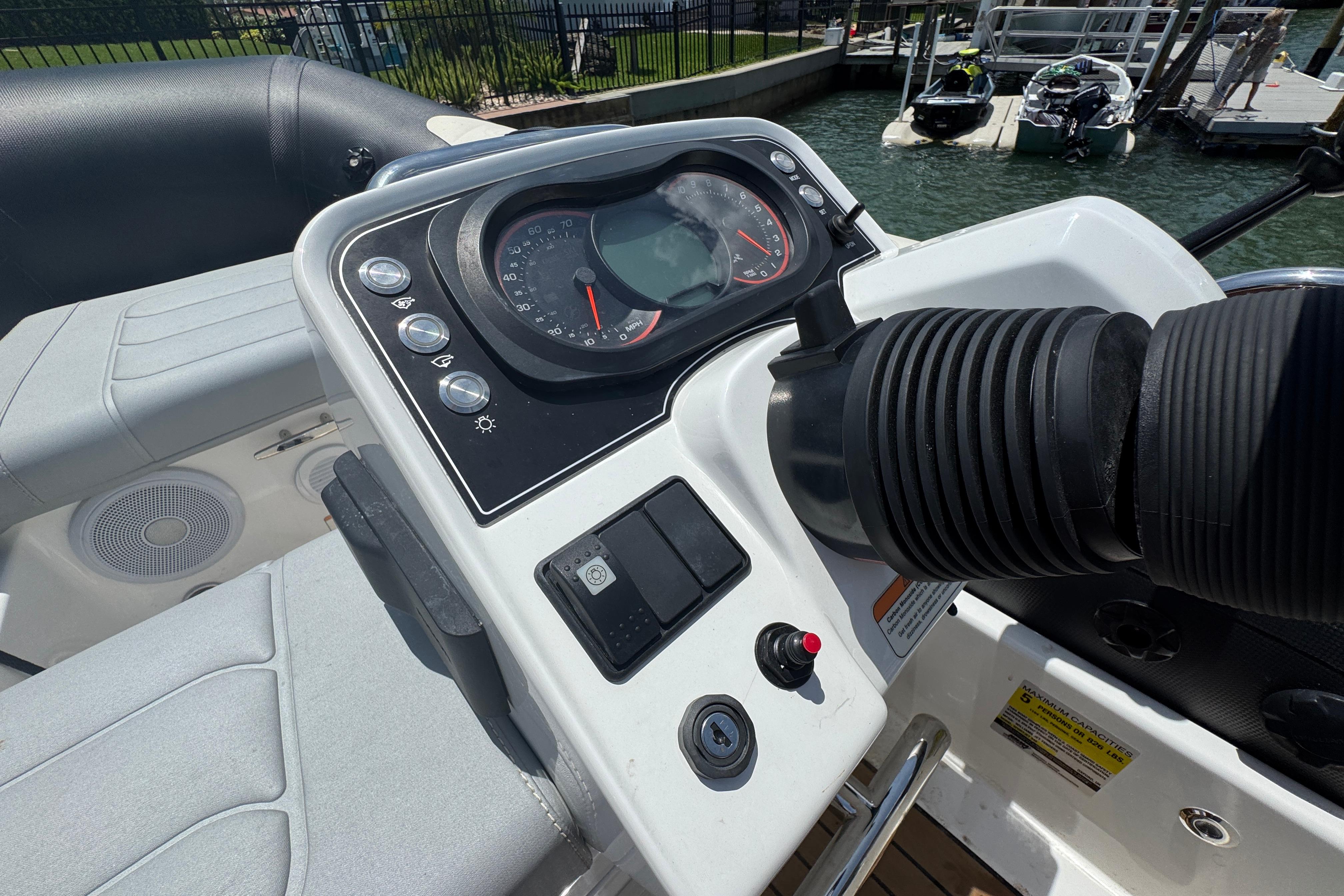 Control panel of 2025 Williams Jet Tenders Sportjet 345, docked by the water.