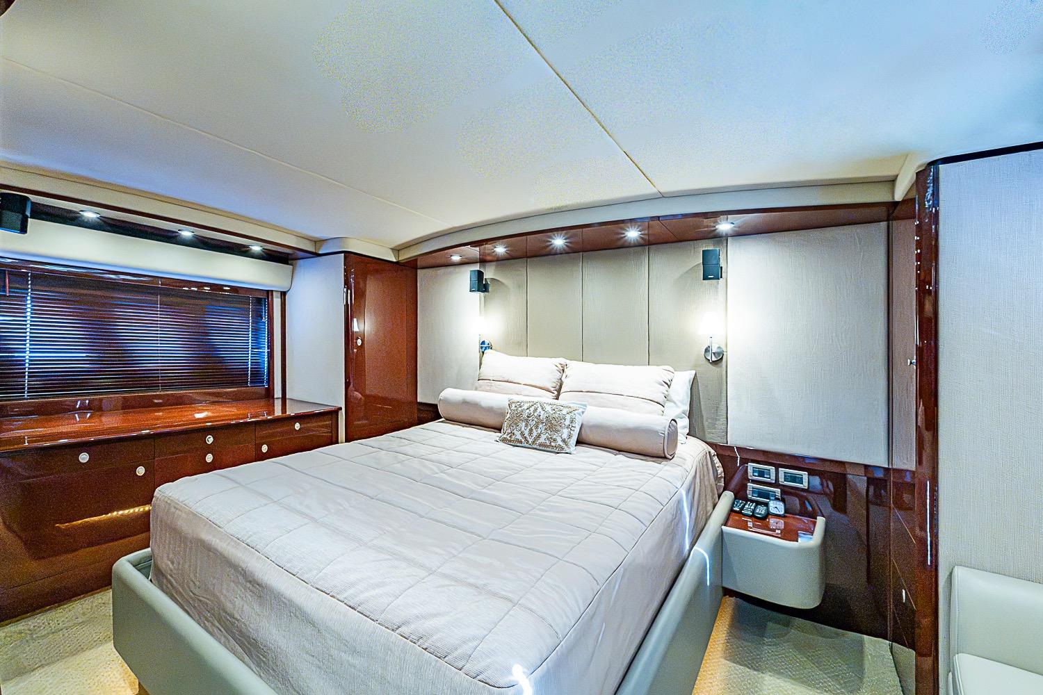 Luxurious bedroom interior of 2008 Sea Ray 60 Sundancer yacht with elegant furnishings.