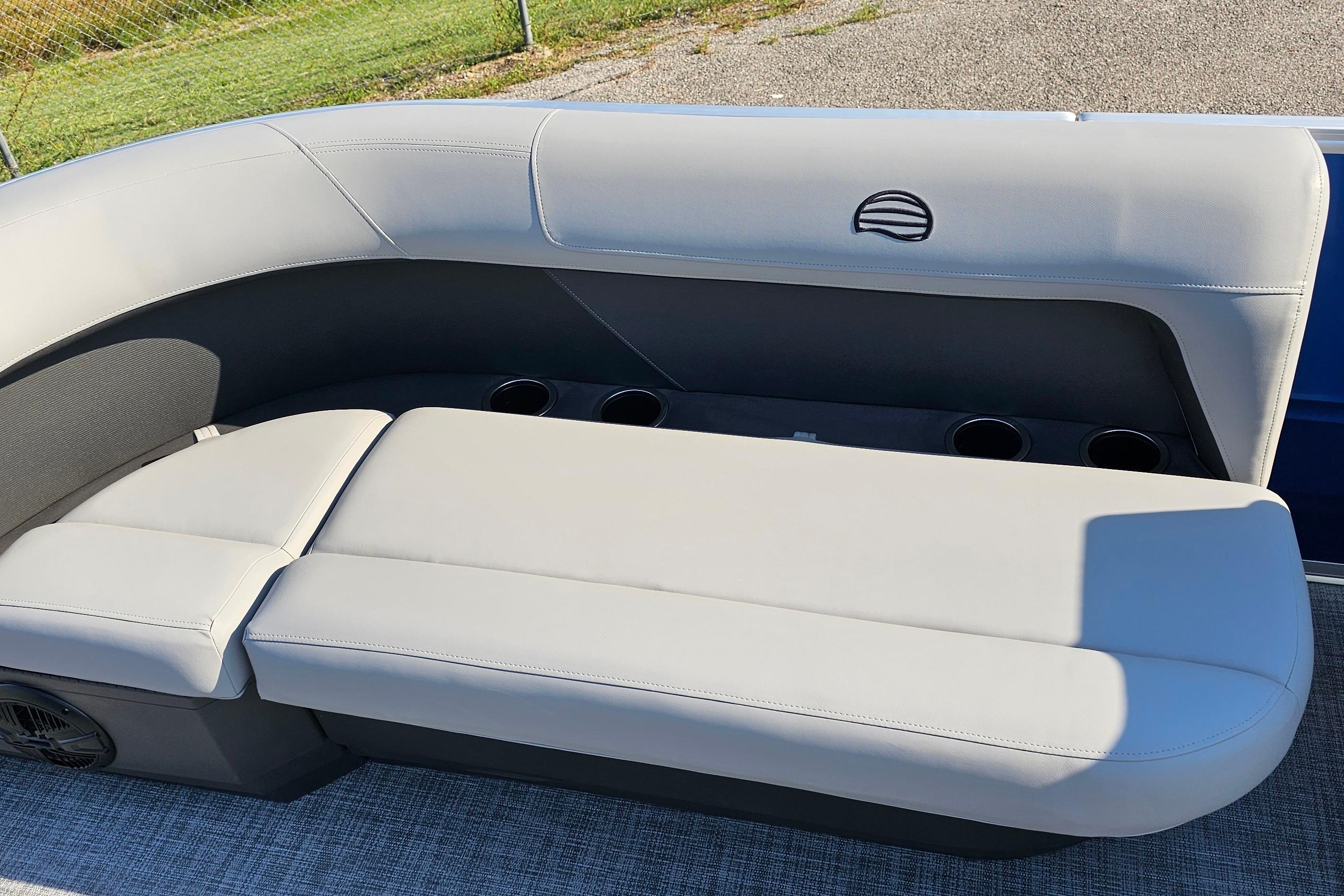 2026 Sun Tracker Party Barge 16 DLX boat seating with cup holders and sleek design.