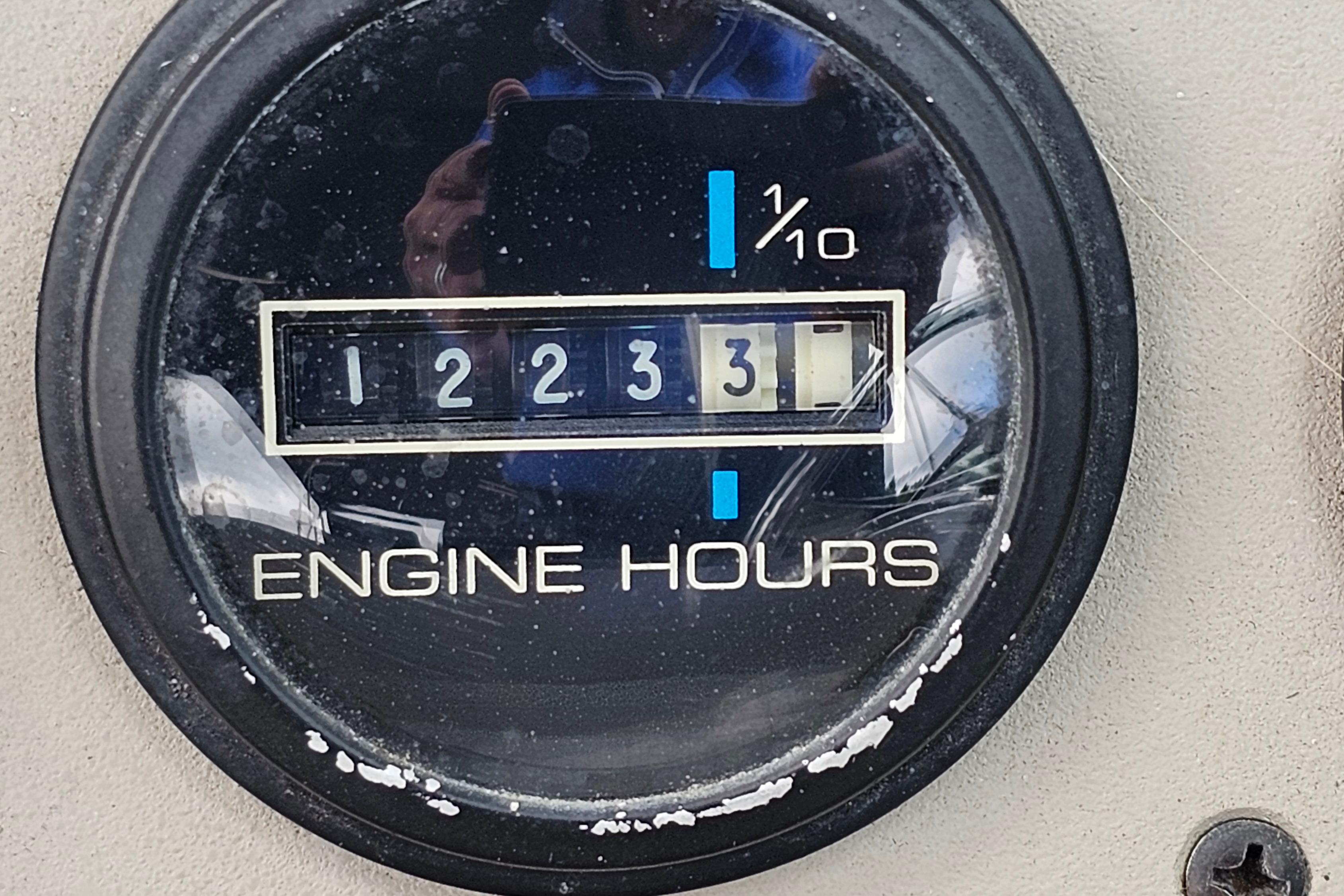 Engine hour meter showing 1223.3 hours on a 1999 Carver 350 Mariner.