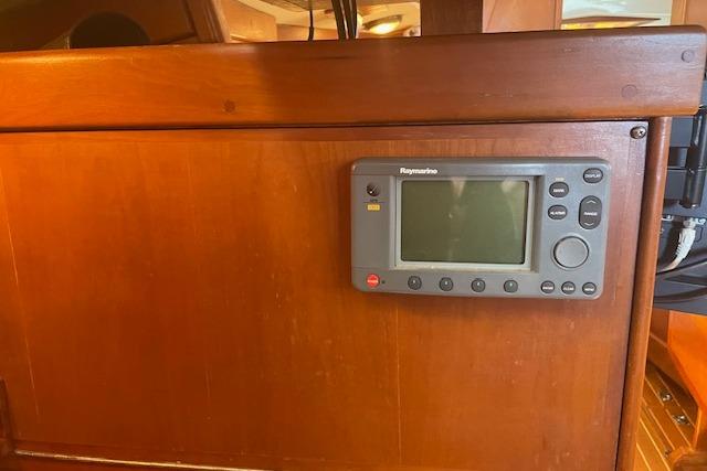 Raymarine navigation system on 2001 Tartan 3700 yacht's wooden interior panel.