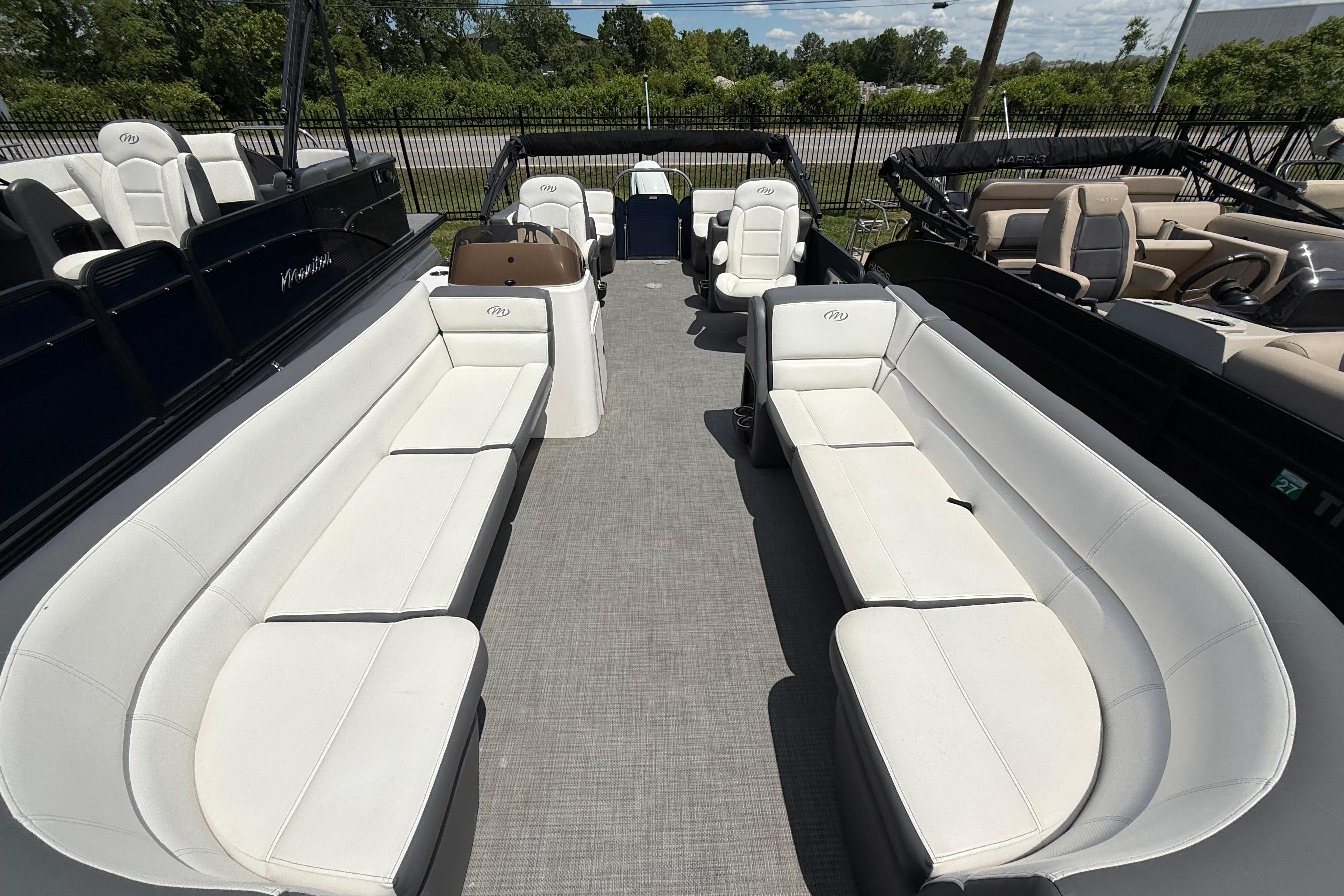 2022 Manitou Aurora LE pontoon boat with spacious seating and modern design.