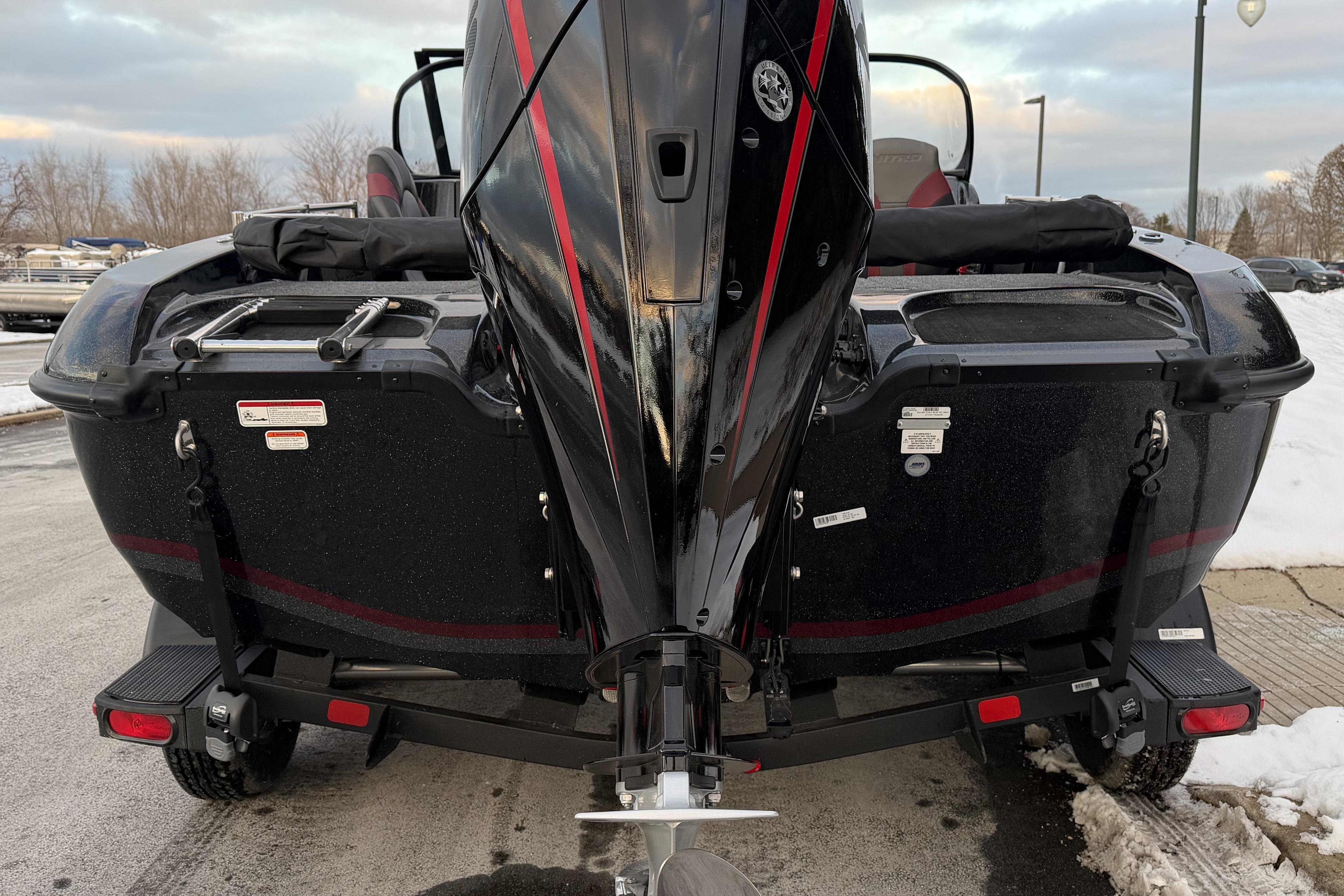 2026 Nitro ZV19 Sport Pro boat rear view with motor and trailer.