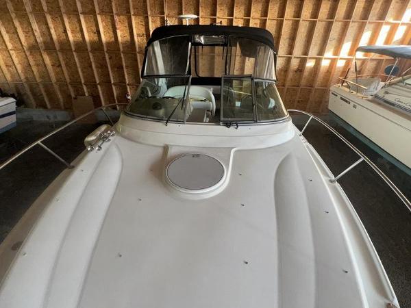 2005 Four Winns 298 Vista boat in storage, front view.