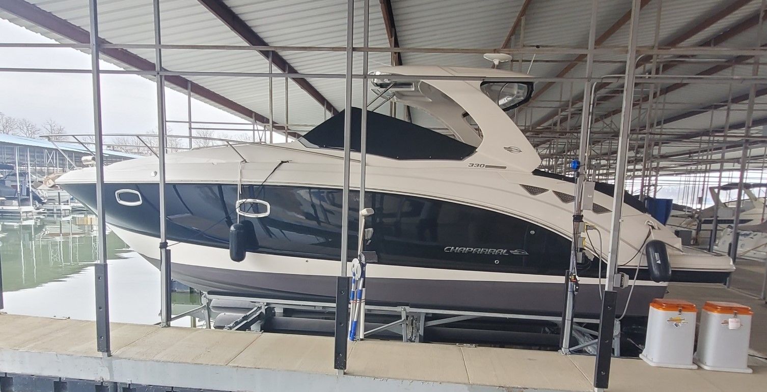 2014 Chaparral 330 Signature Yacht in covered dock.