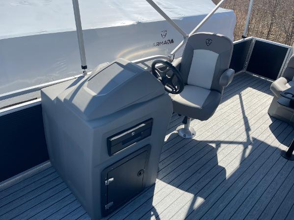 2025 Armada Saphir 23CR boat helm with steering wheel and captain's chair.