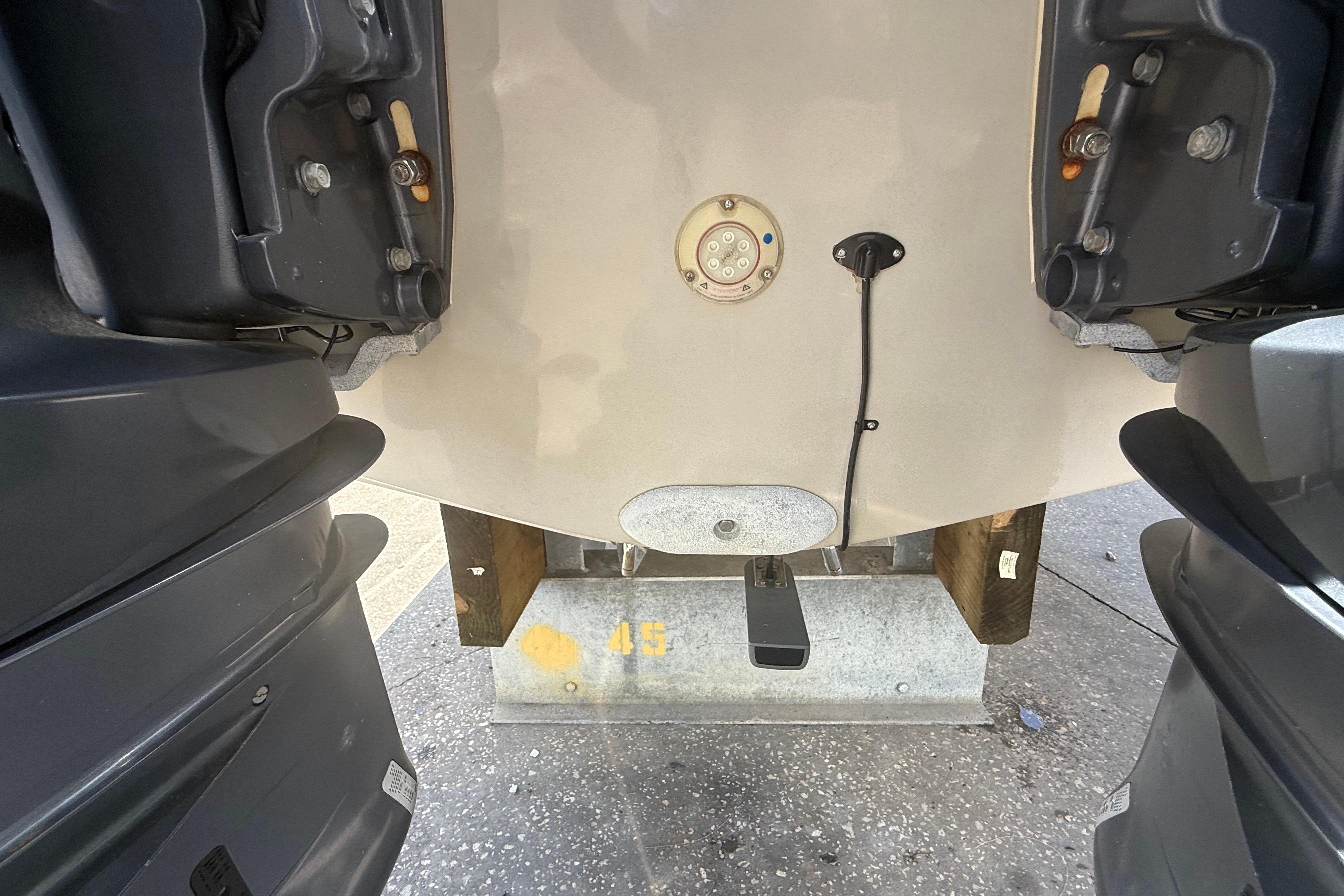 2019 Key West Billistic 281 Center Console boat stern with dual outboard motors.