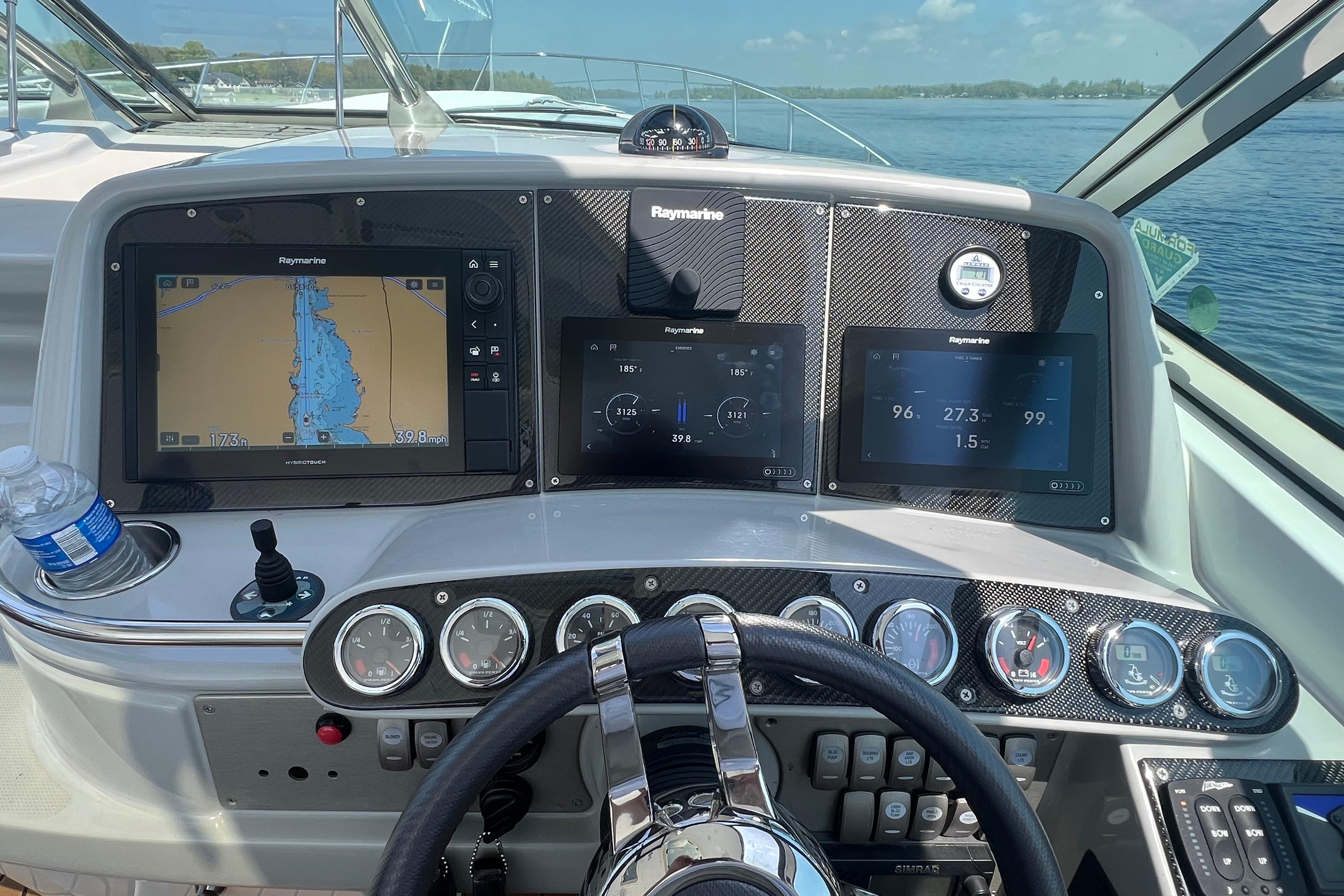 Dashboard of a 2008 Formula 400 Super Sport boat with navigation screens and controls.