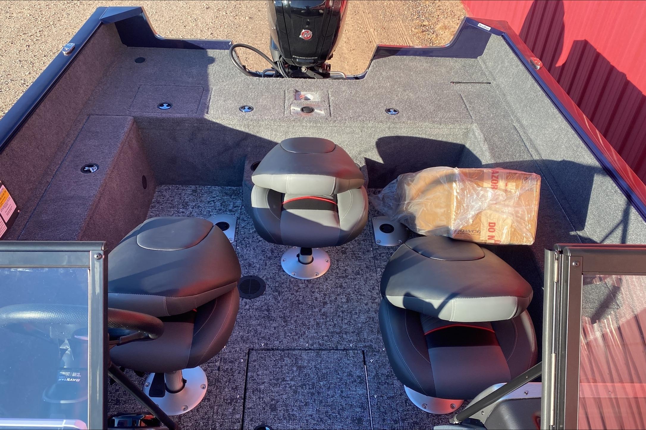 2026 Tracker Pro Guide V-175 WT boat interior with three seats and carpeted flooring.