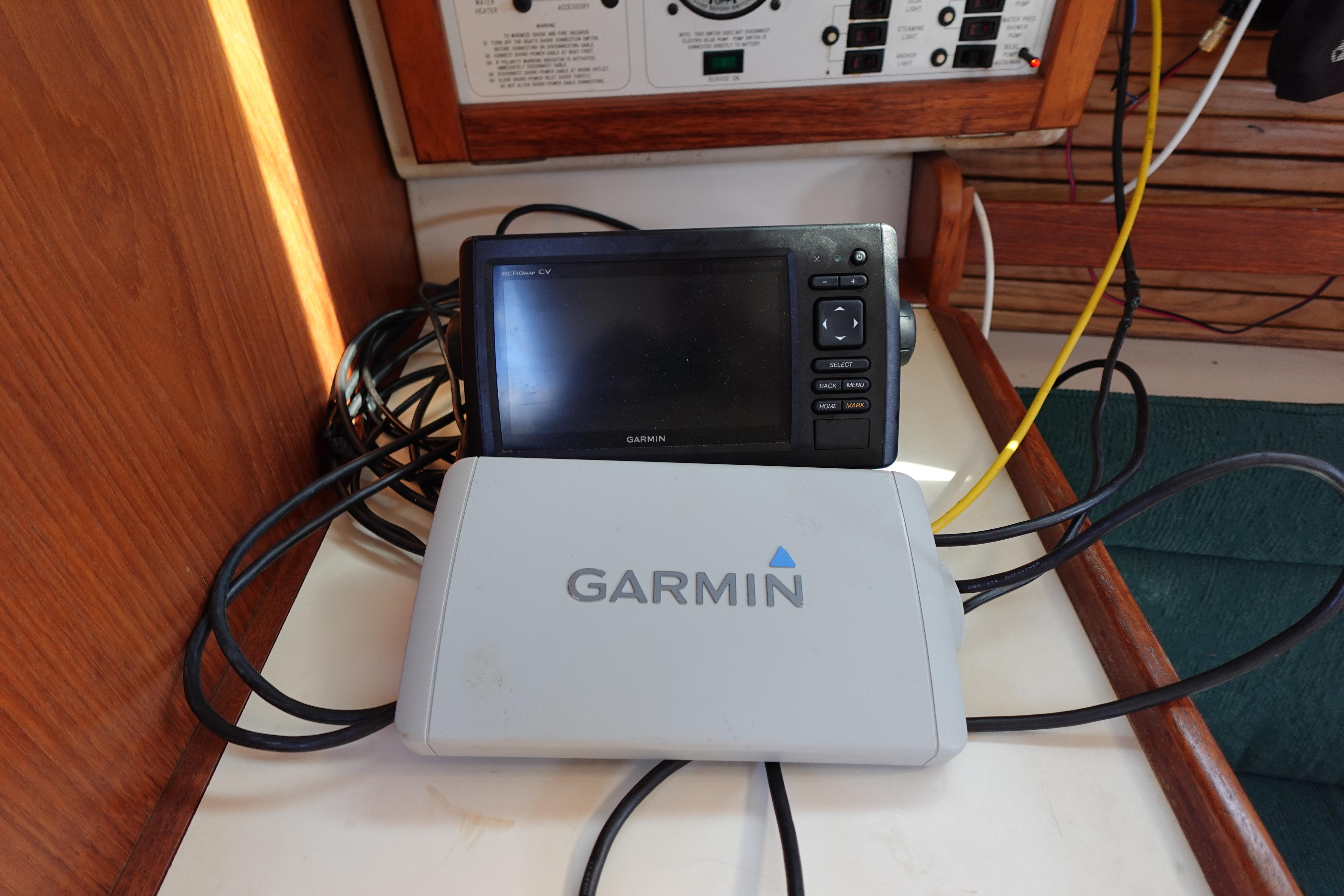 Garmin navigation system on 1997 Catalina 28 sailboat, featuring cables and control panel.