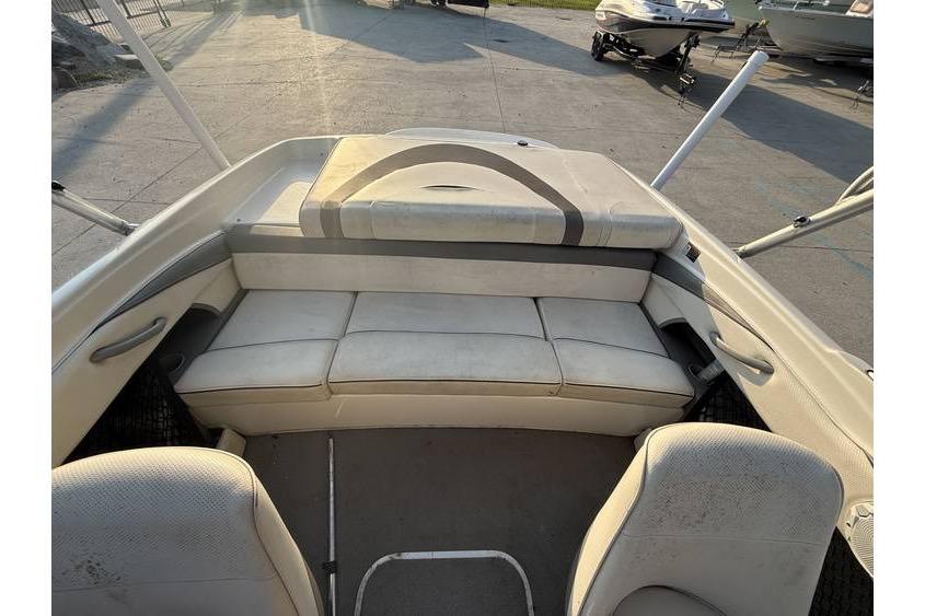 2008 Bayliner 185 Bowrider interior with cushioned seating and open deck layout.