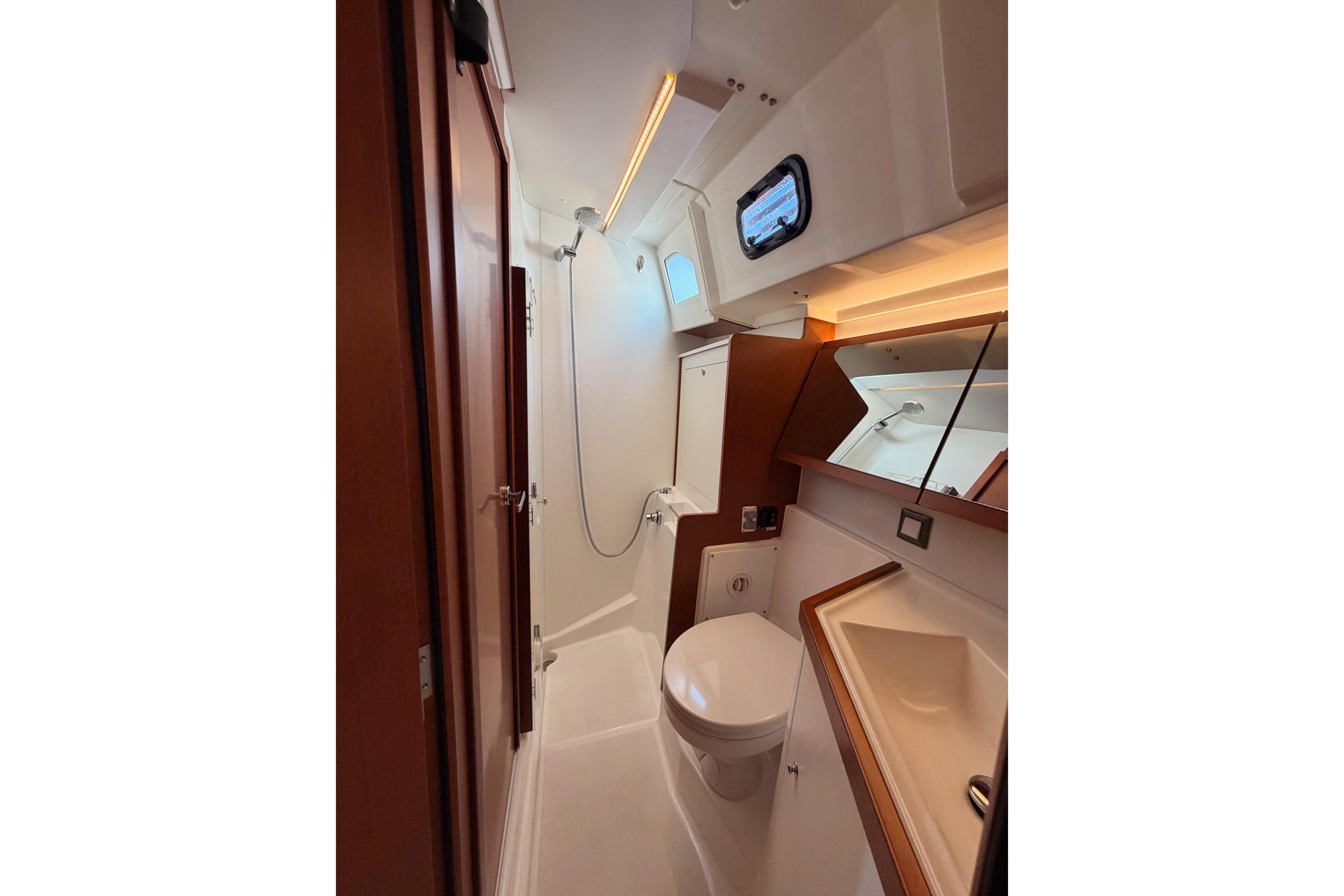 Modern bathroom in 2020 Beneteau Oceanis 46.1 yacht, featuring sleek design and compact amenities.