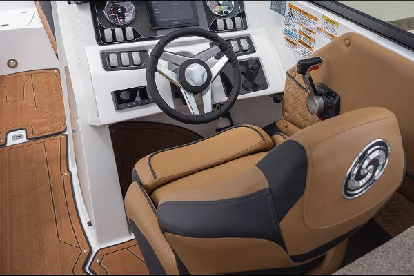 Manufacturer Provided Image: 2026 Hurricane SunDeck 2690 OB boat cockpit with tan seating and modern steering controls.