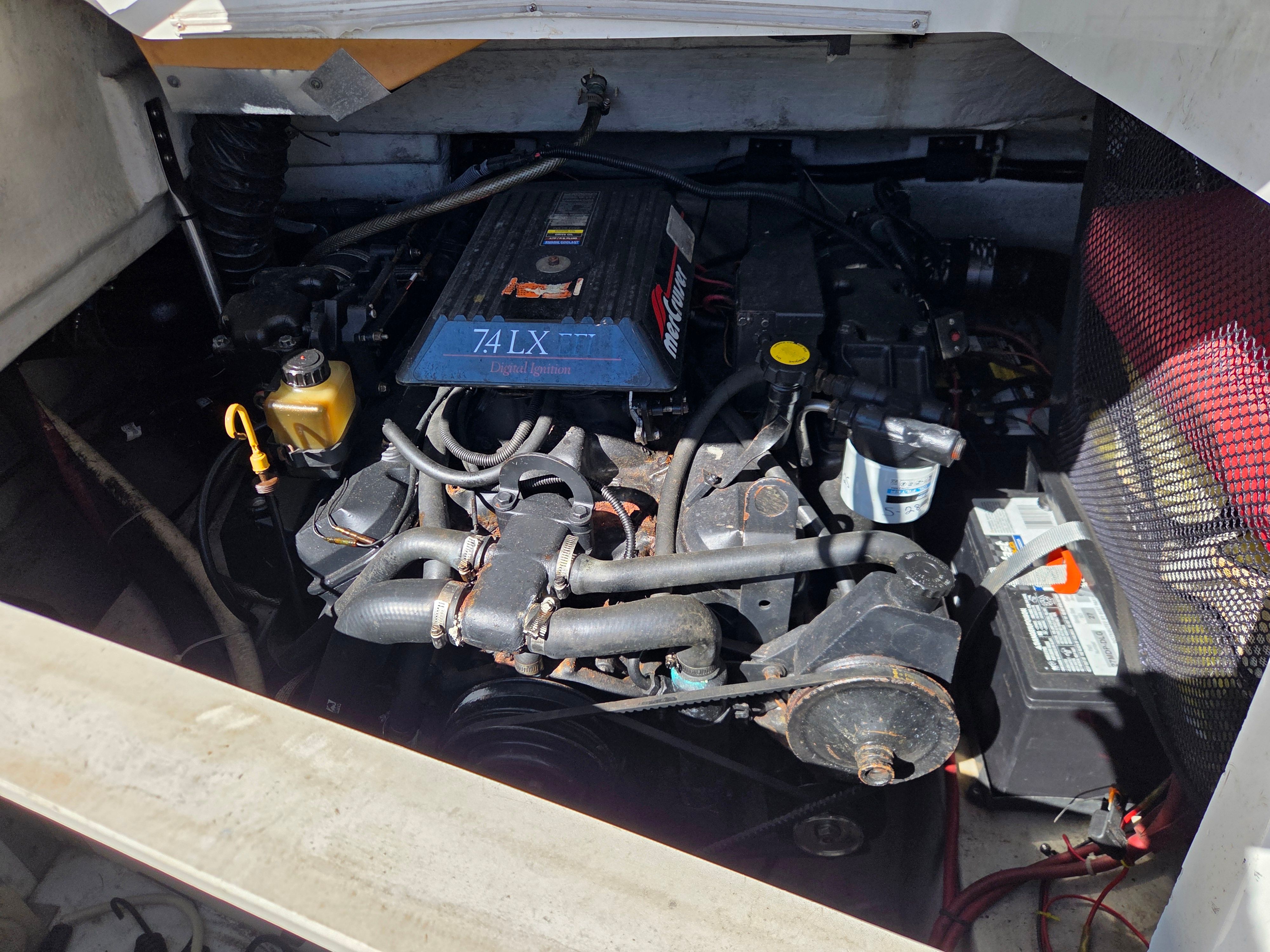 Engine compartment of a 1997 Cobalt 23LS with 7.4 LX EFI engine.