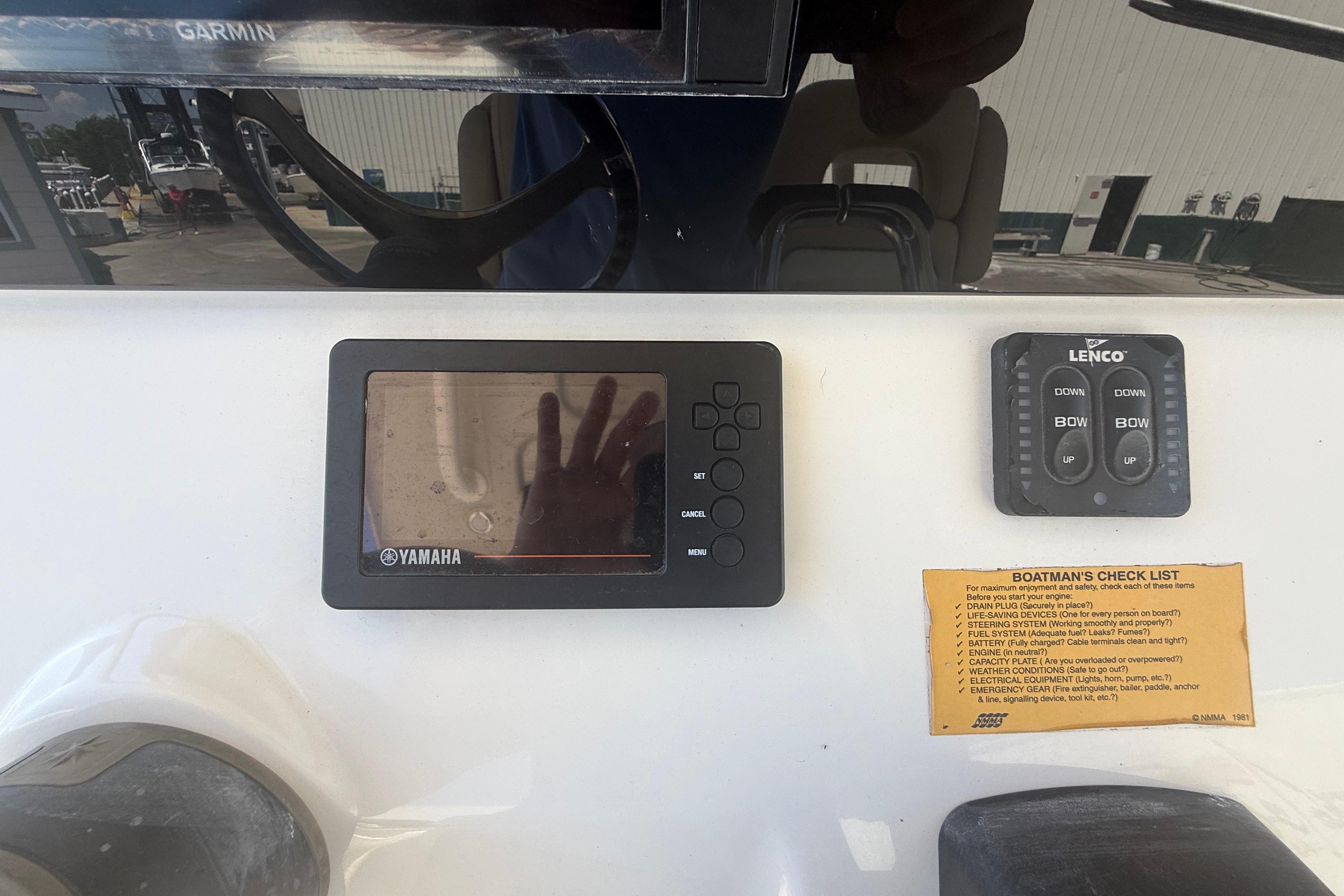 2019 Key West Billistic 281 Center Console dashboard with Yamaha display and Lenco controls.