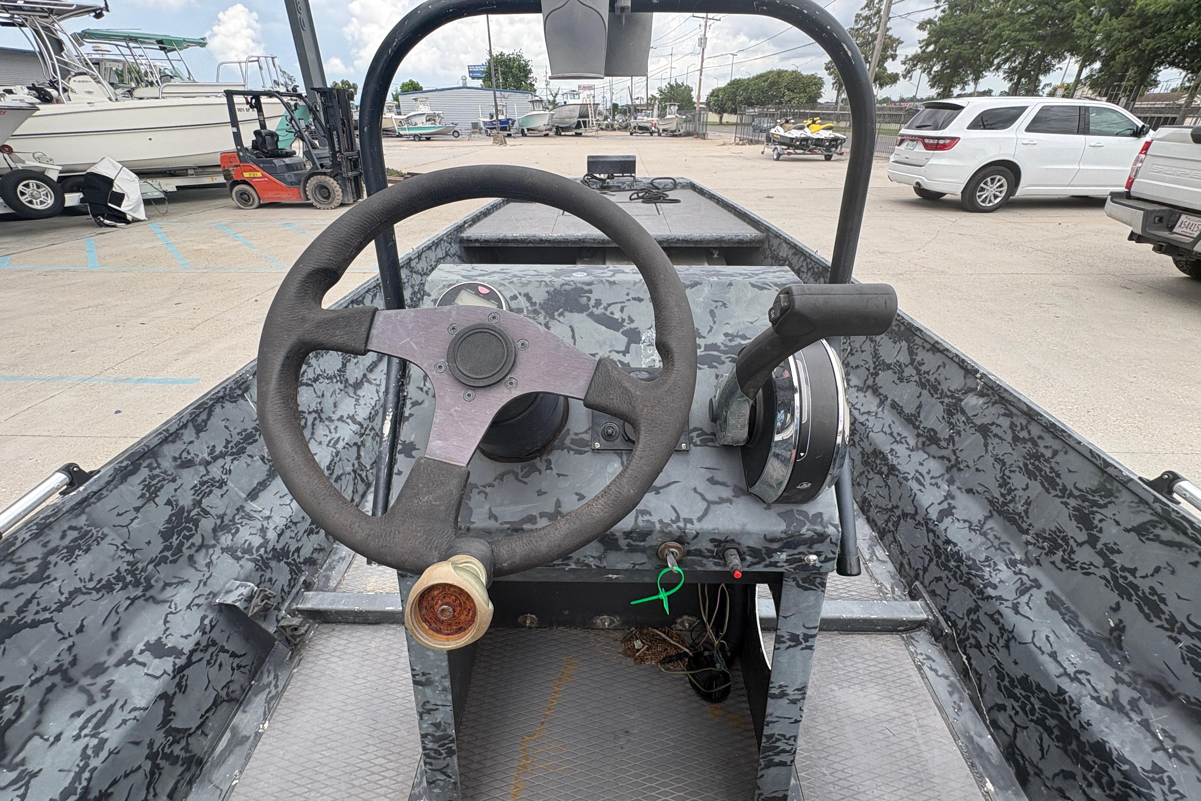 Interior view of a 2020 Gator Tail Extreme boat with steering wheel and controls.