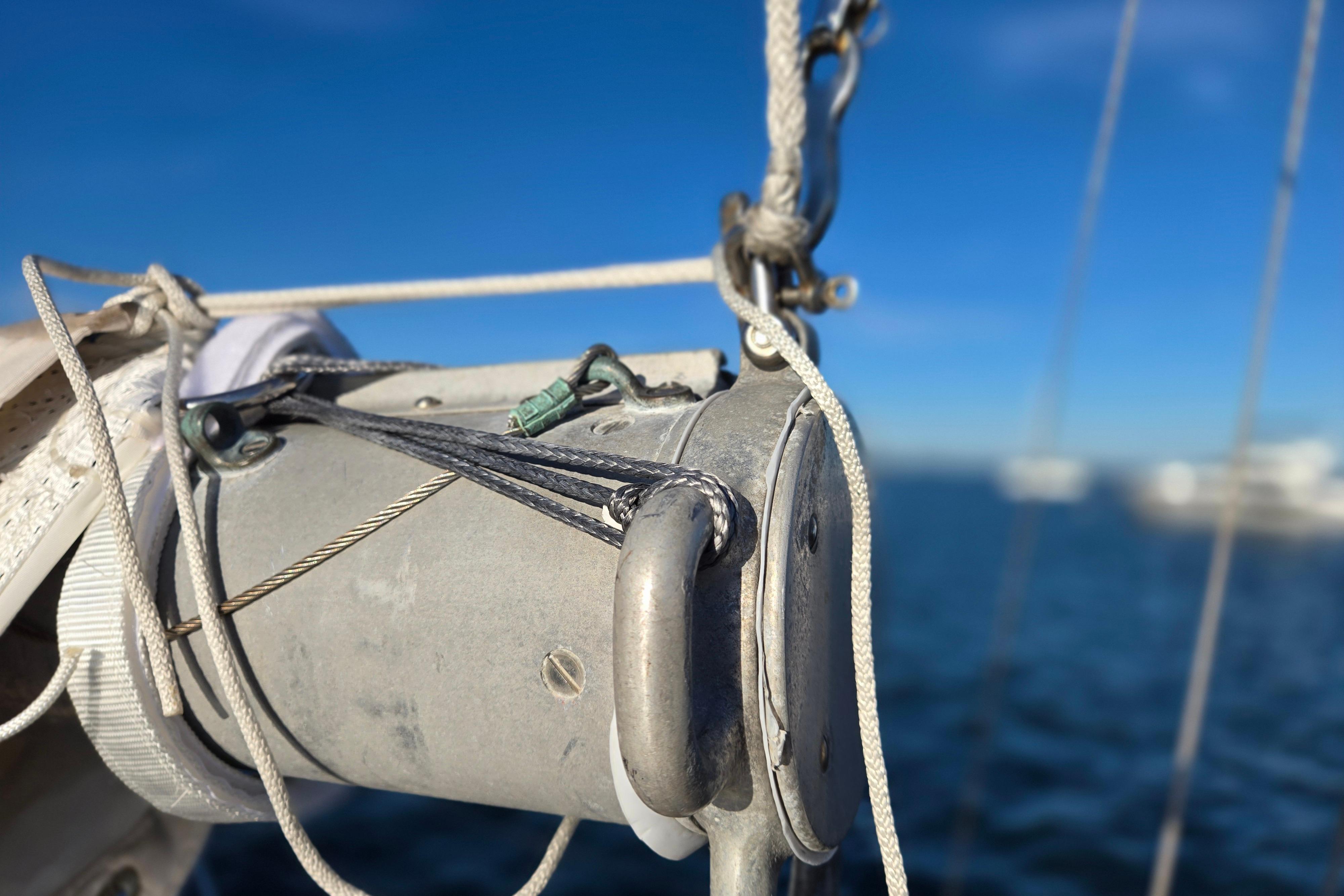 Close-up of rigging on a 1970 Hinckley Bermuda 40 sailboat against a blue sky.