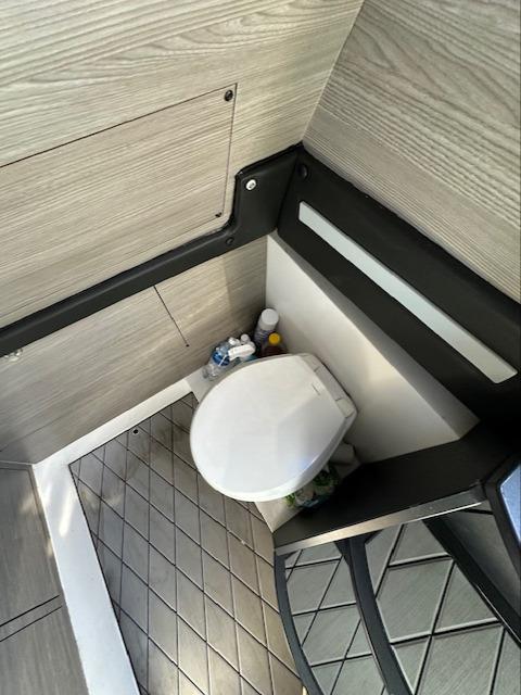 2019 Mystic Powerboats M4200 interior bathroom with modern design and compact toilet.