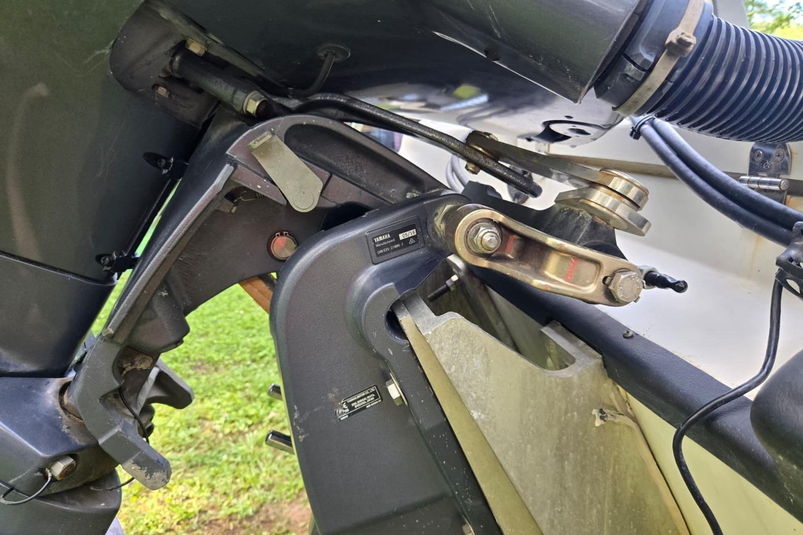 Close-up of 2016 Epic 21 Sport Console boat engine components.