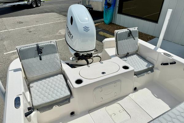 2025 Carolina Skiff 21 LS boat interior with seating and outboard motor.