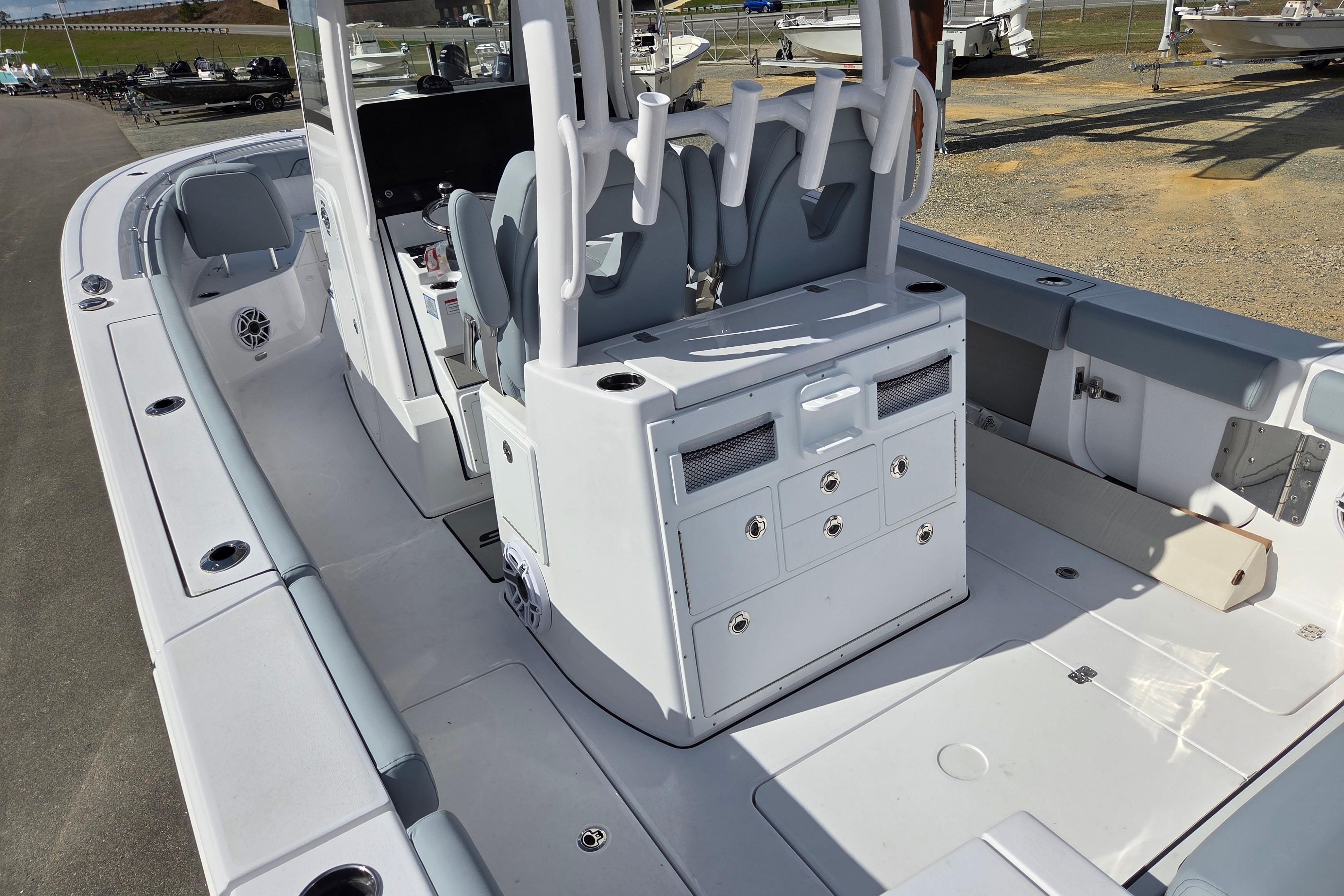 2026 Sportsman Open 282 Center Console boat interior with seating and storage compartments.