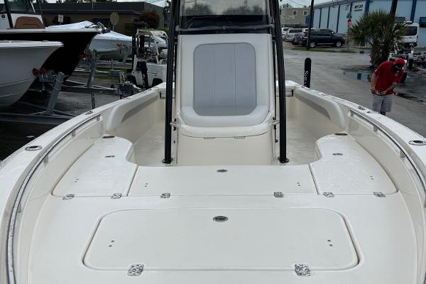 2024 ShearWater 260 Carolina Flare boat, spacious deck view, parked outdoors.