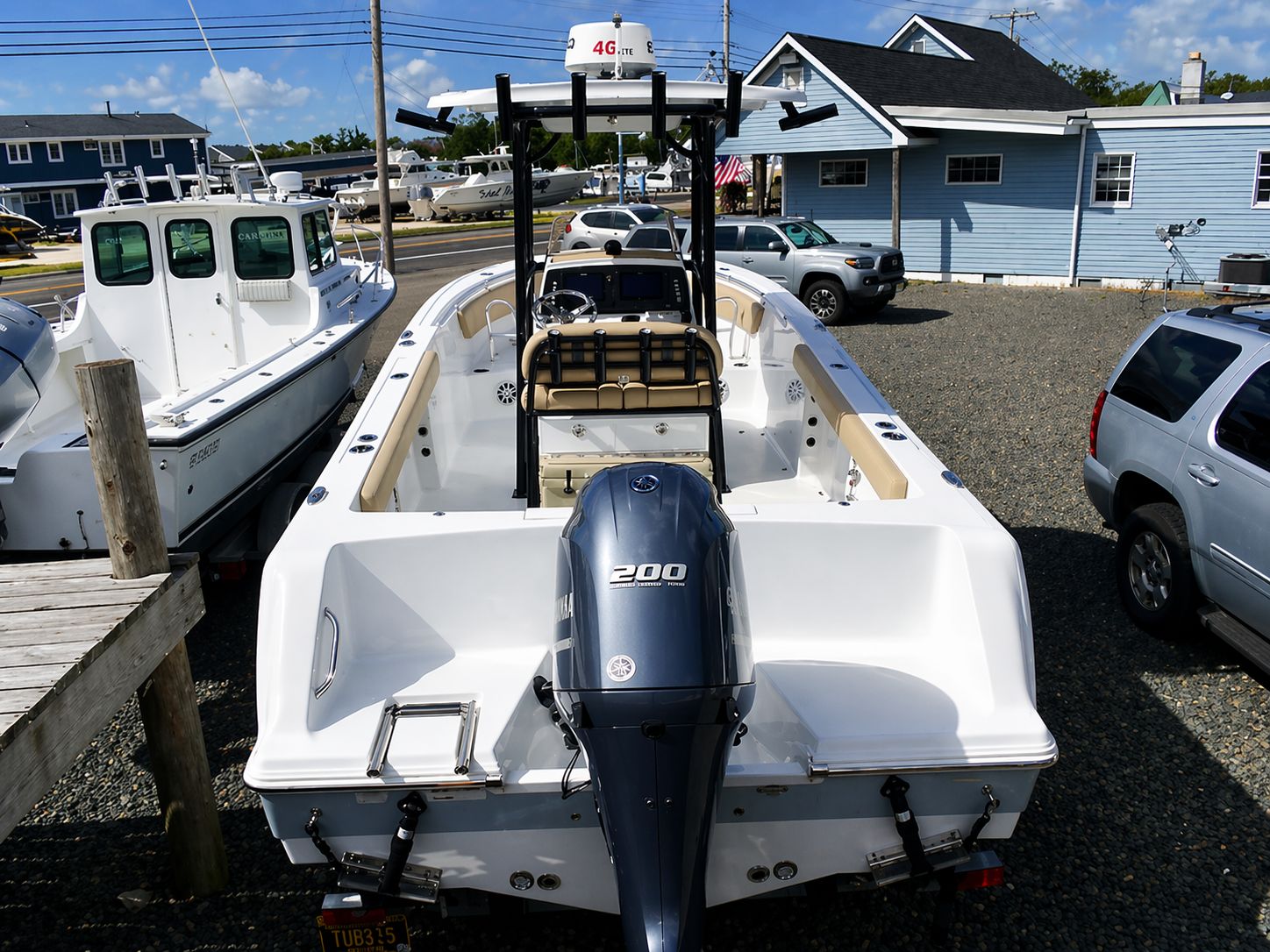 2018 Sportsman Heritage 231 Center Console boat in harbor.
