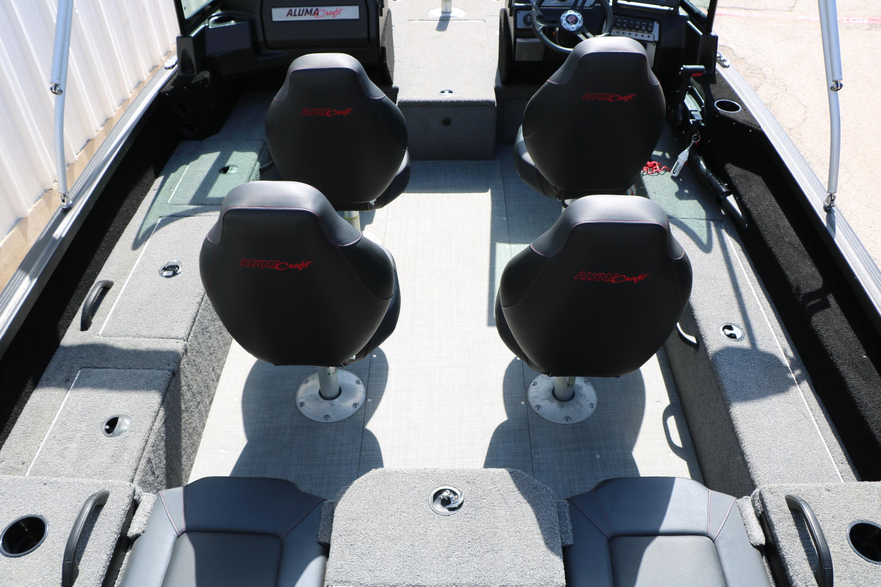 2023 Alumacraft Competitor FSX 185 boat interior with four seats and steering console.