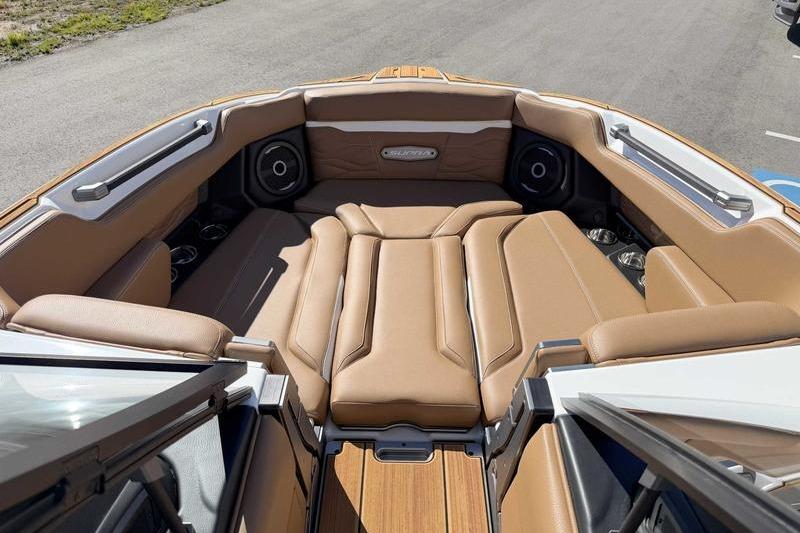2026 Supra SL boat interior with tan leather seating and modern audio system.