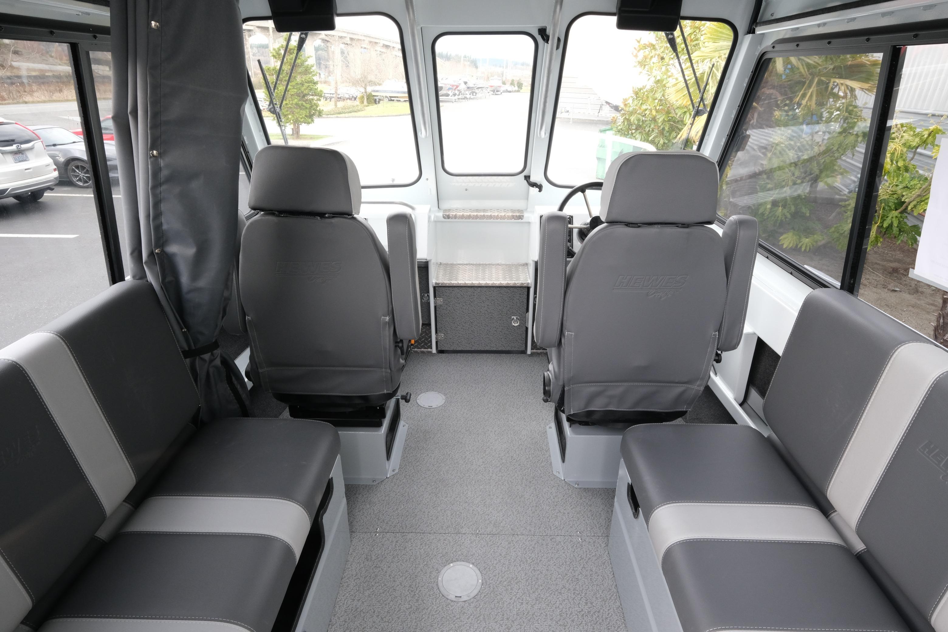 Interior of 2026 Hewescraft 210 Sea Runner ET Hardtop, featuring gray seating and spacious layout.