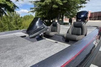 2014 Skeeter ZX200 boat with dual seats and motor, parked outdoors.