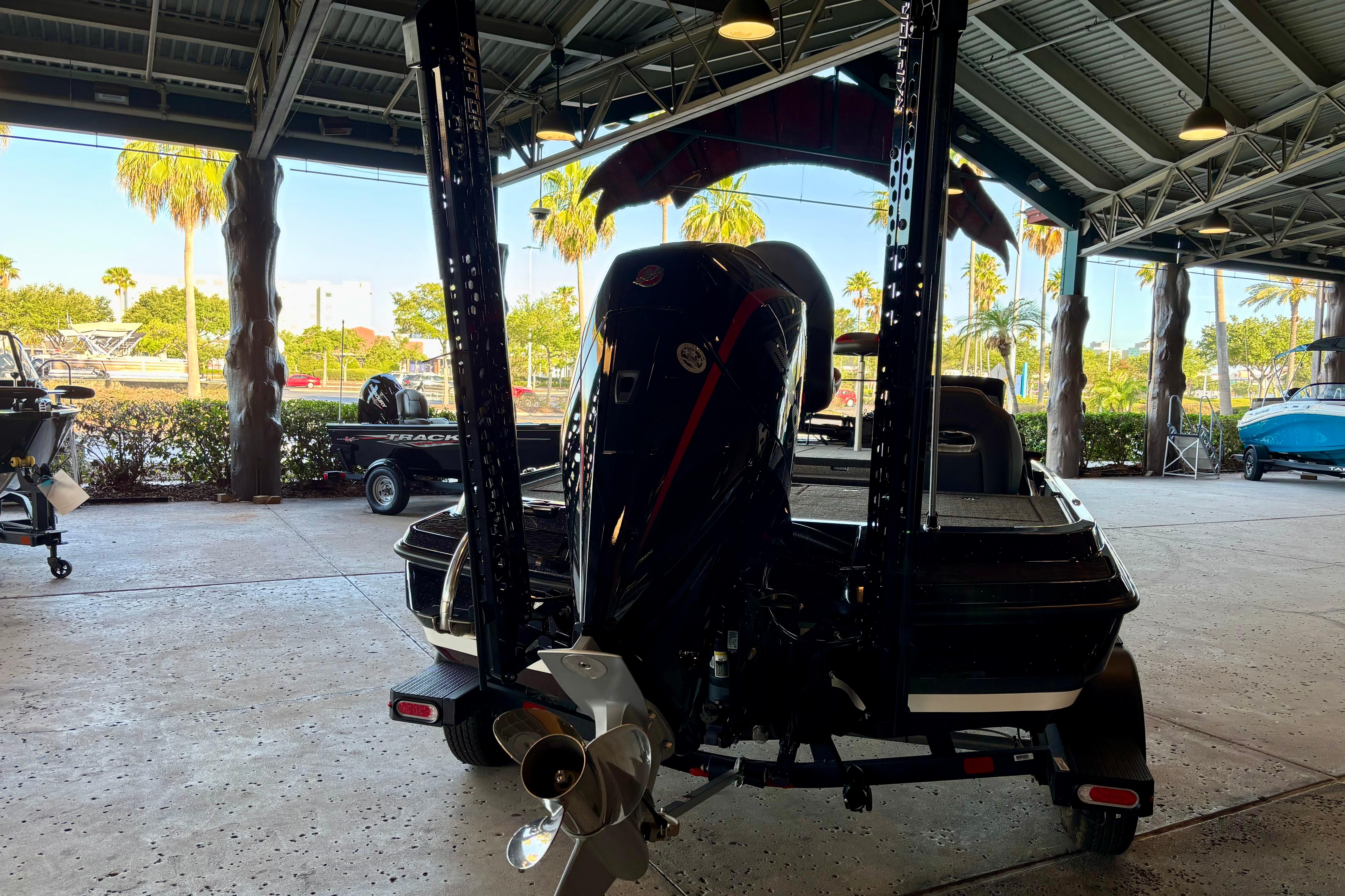 2026 Nitro Z20 XL Pro boat in a covered marina, showcasing its powerful engine.