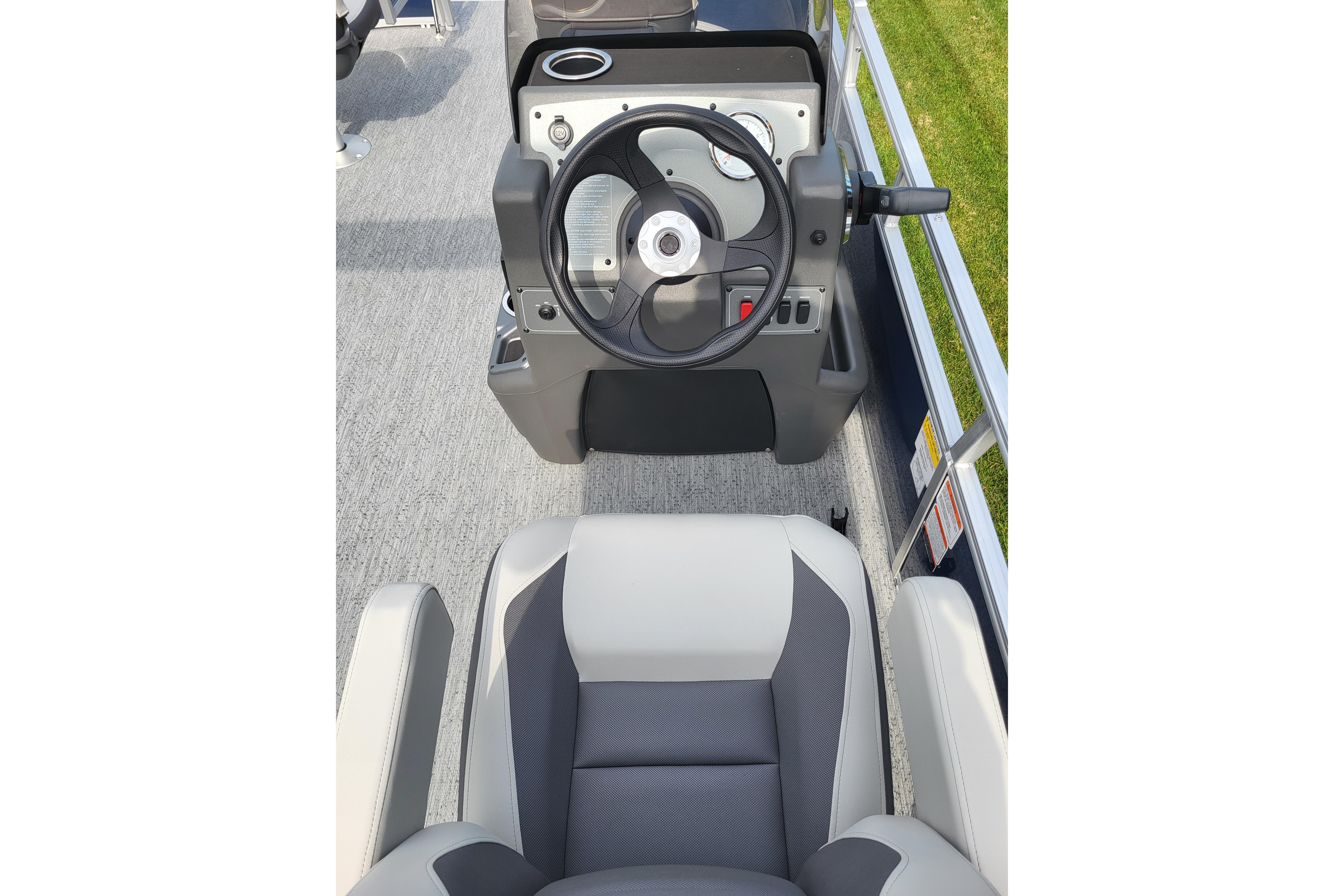 2026 Sun Tracker Bass Buggy 16 XL Select steering console and seating detail.