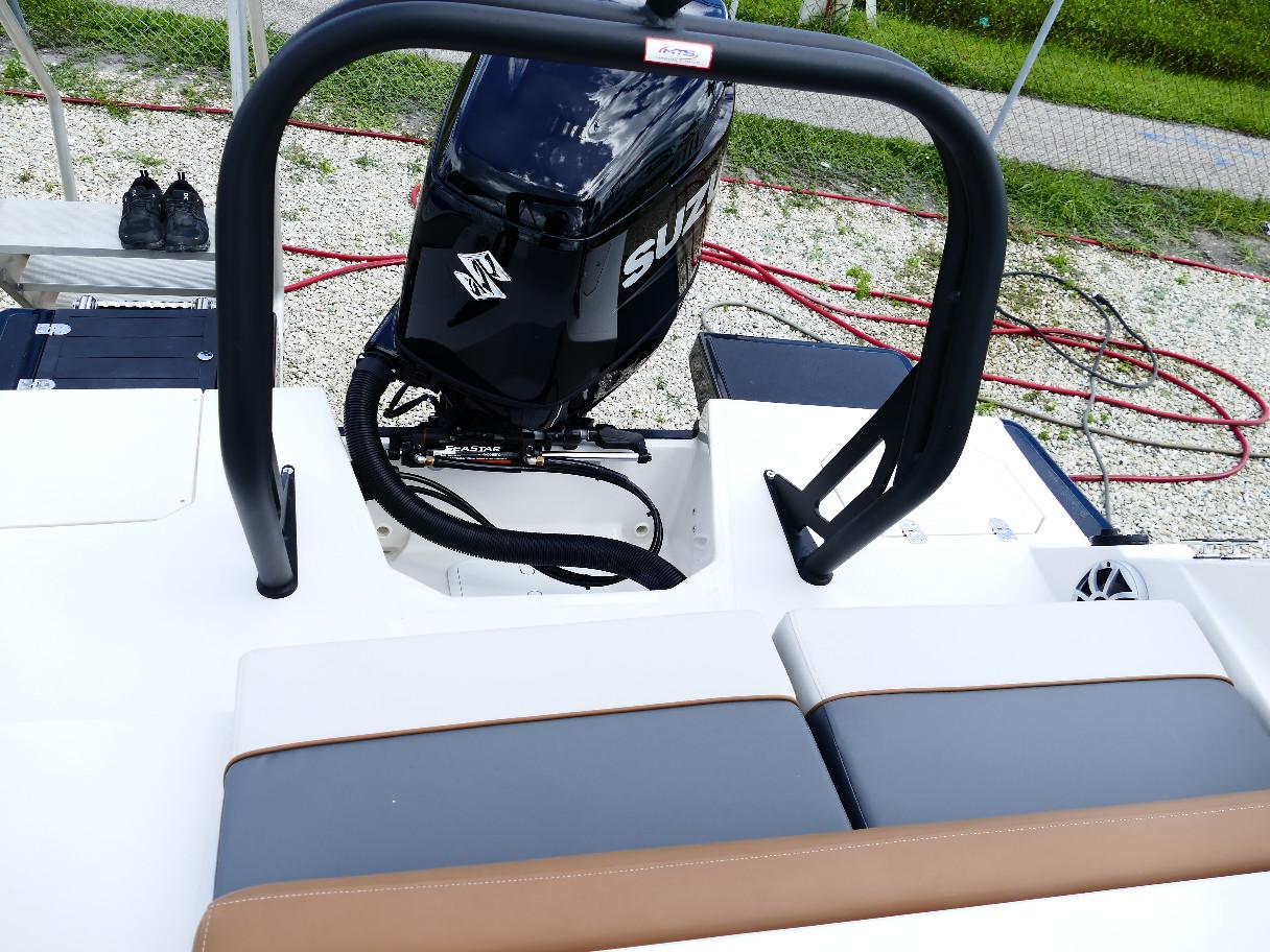 2026 Starcraft SVX 231 OB boat with Suzuki outboard motor and cushioned seating.