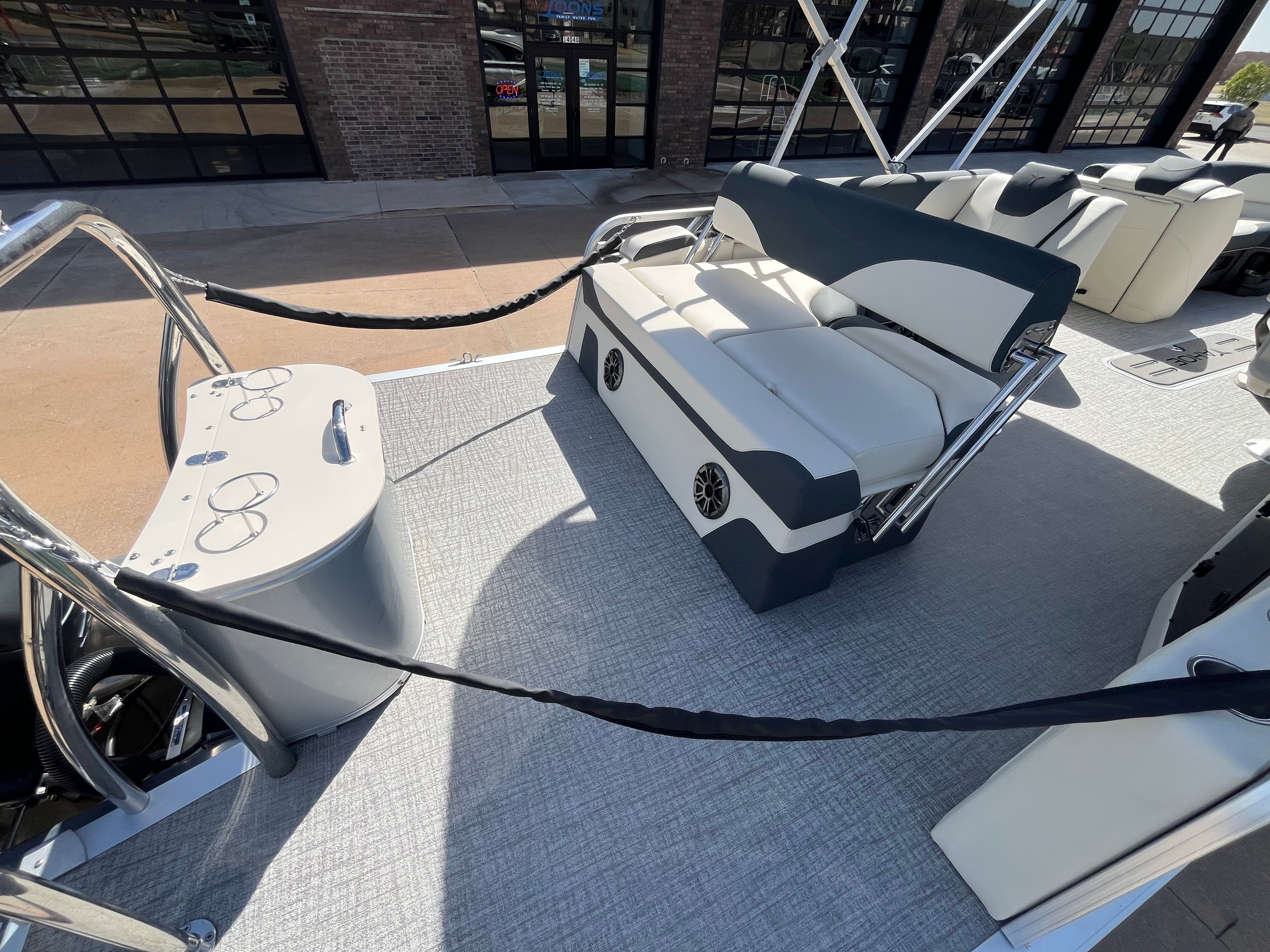 2026 Tahoe 2385 LTZ Cruise with rear bench on boat dock.