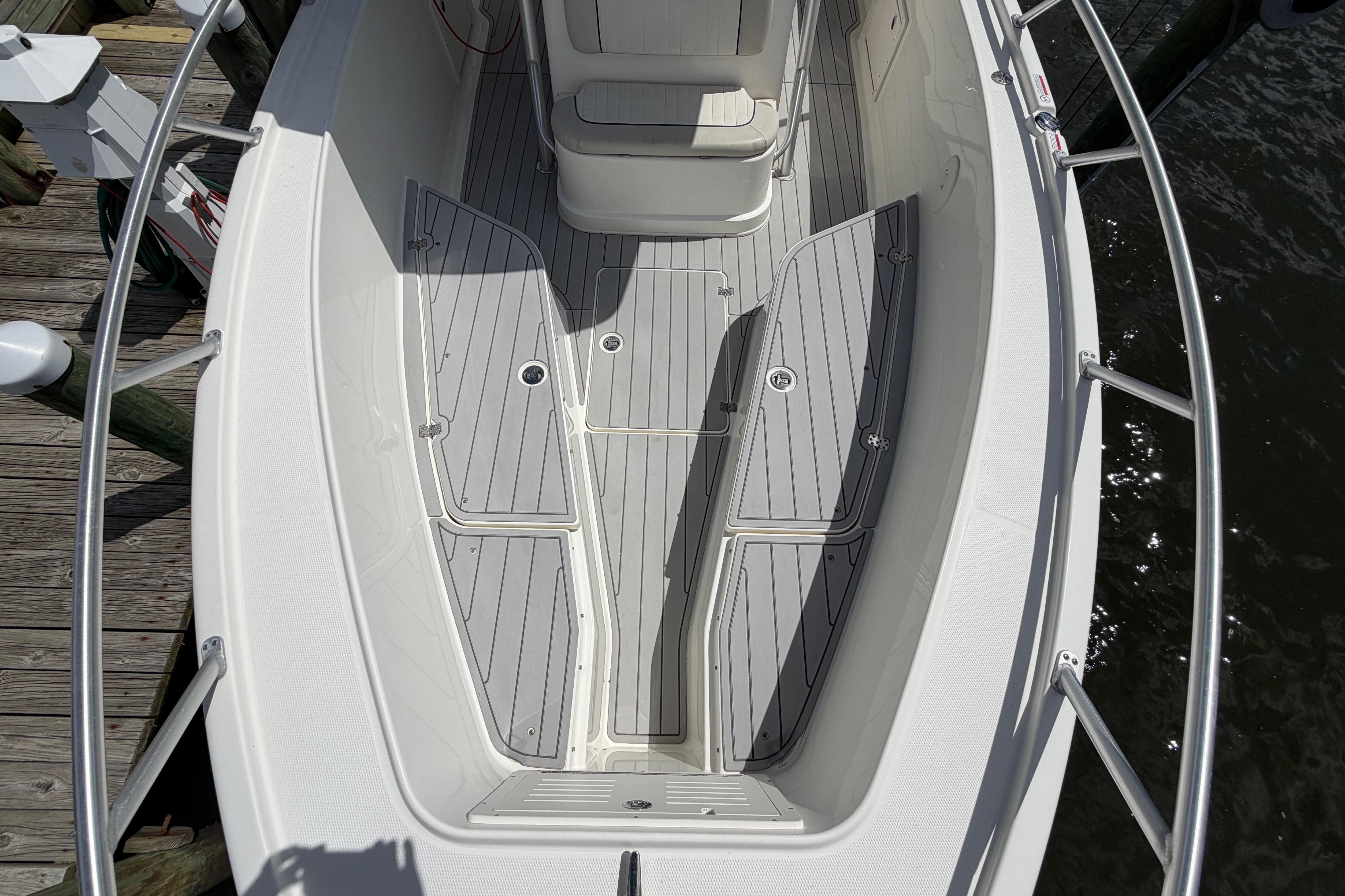 2017 Mako 284 Center Console boat with sleek deck design and seating.