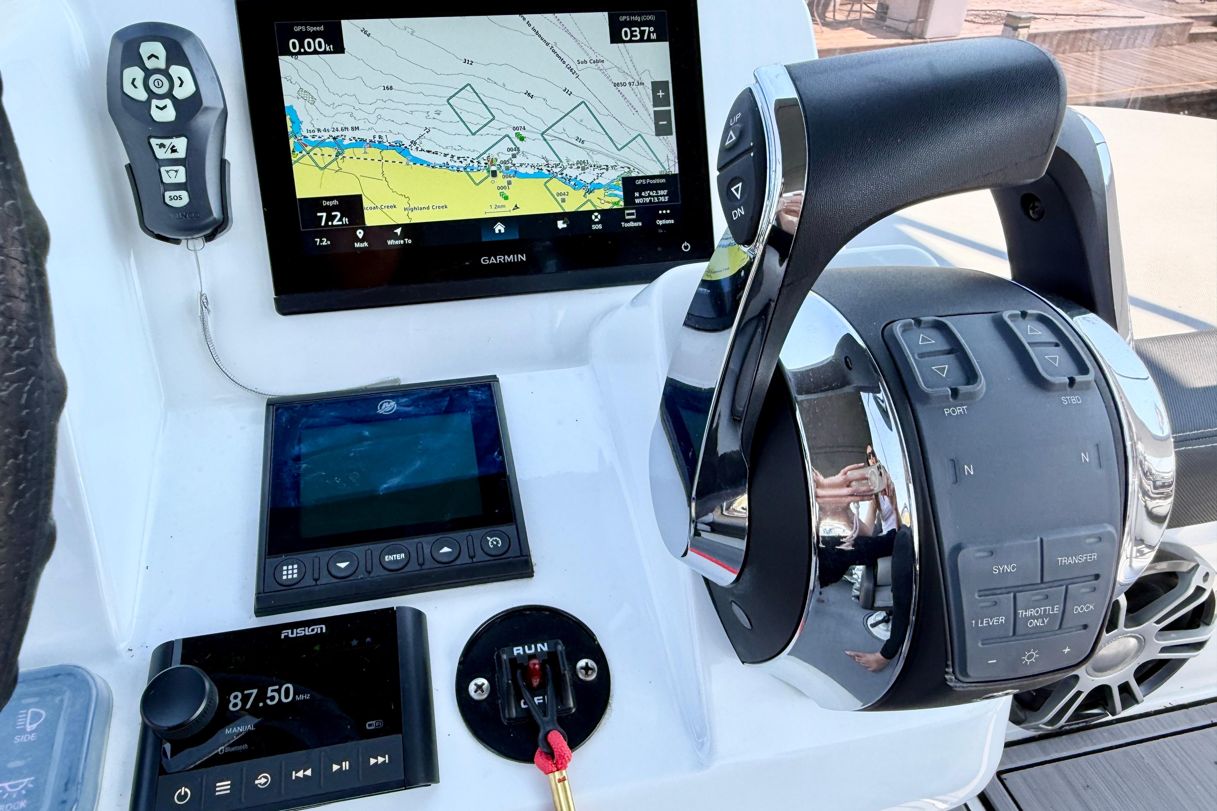Control panel of 2022 Jeanneau NC 1095 Fly with Garmin navigation system.