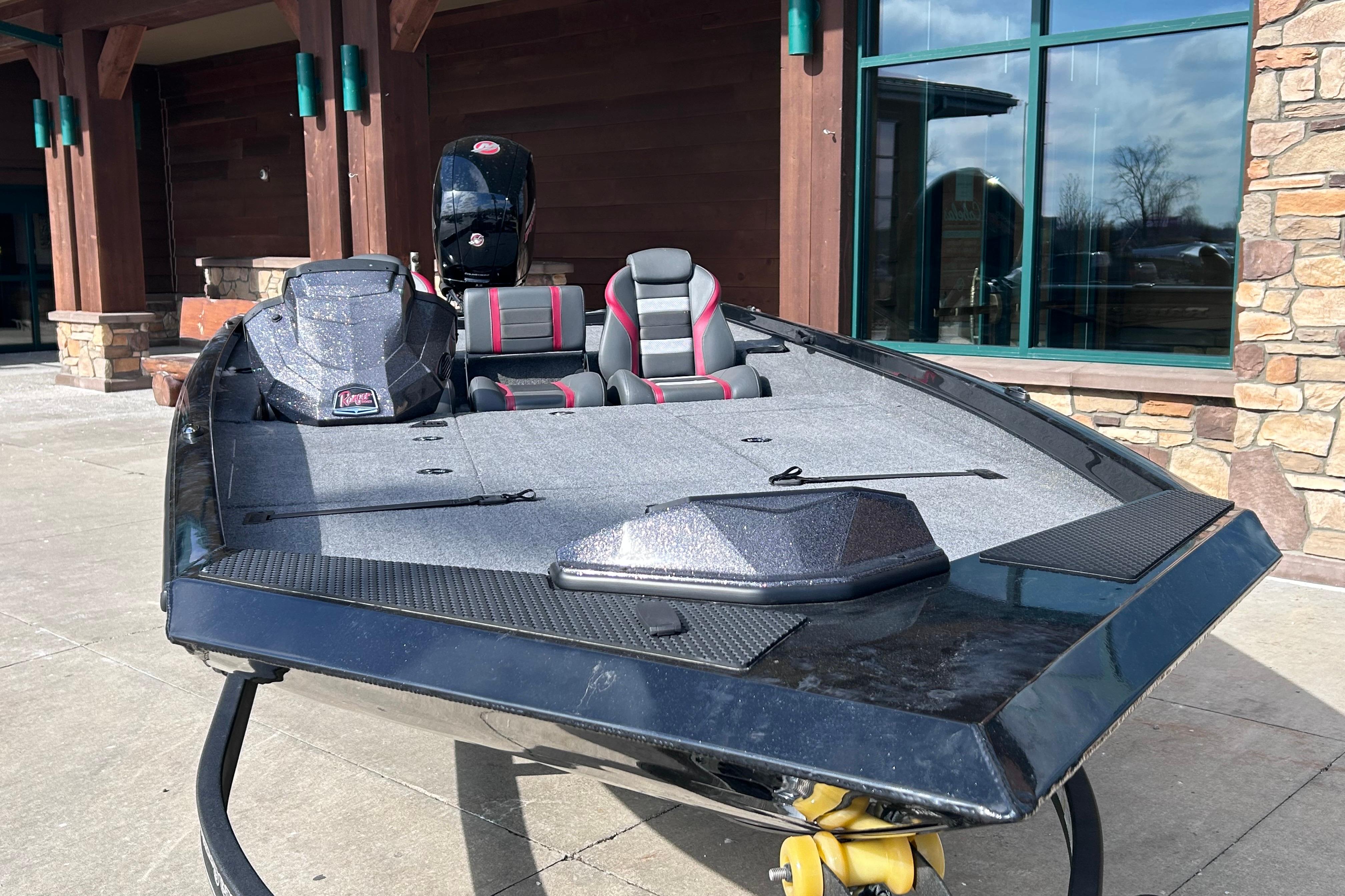 2025 Ranger RT198P boat with sleek design, parked outside a building.
