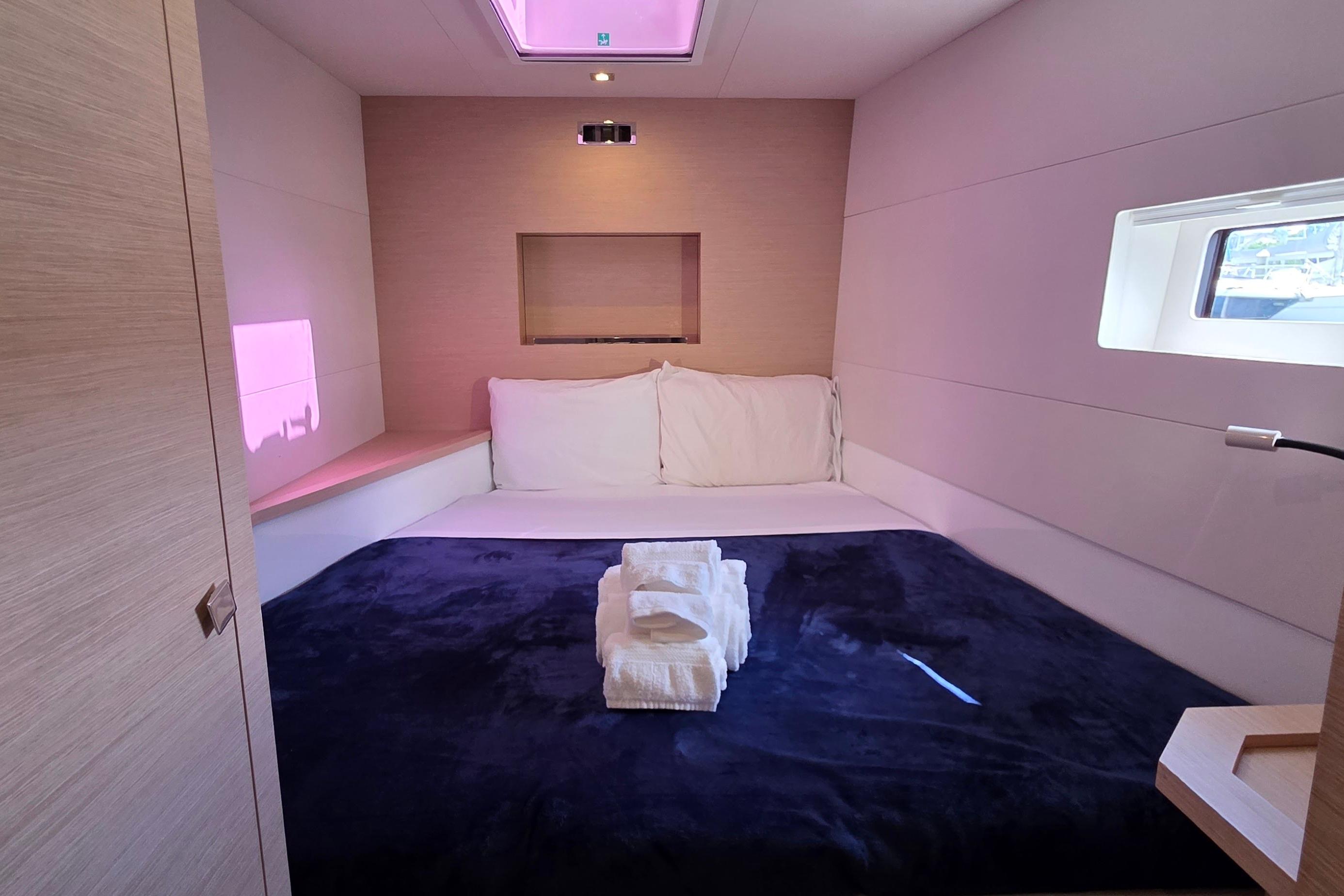 Luxurious bedroom interior of 2018 Fountaine Pajot Motor Yacht 44 with plush bedding.