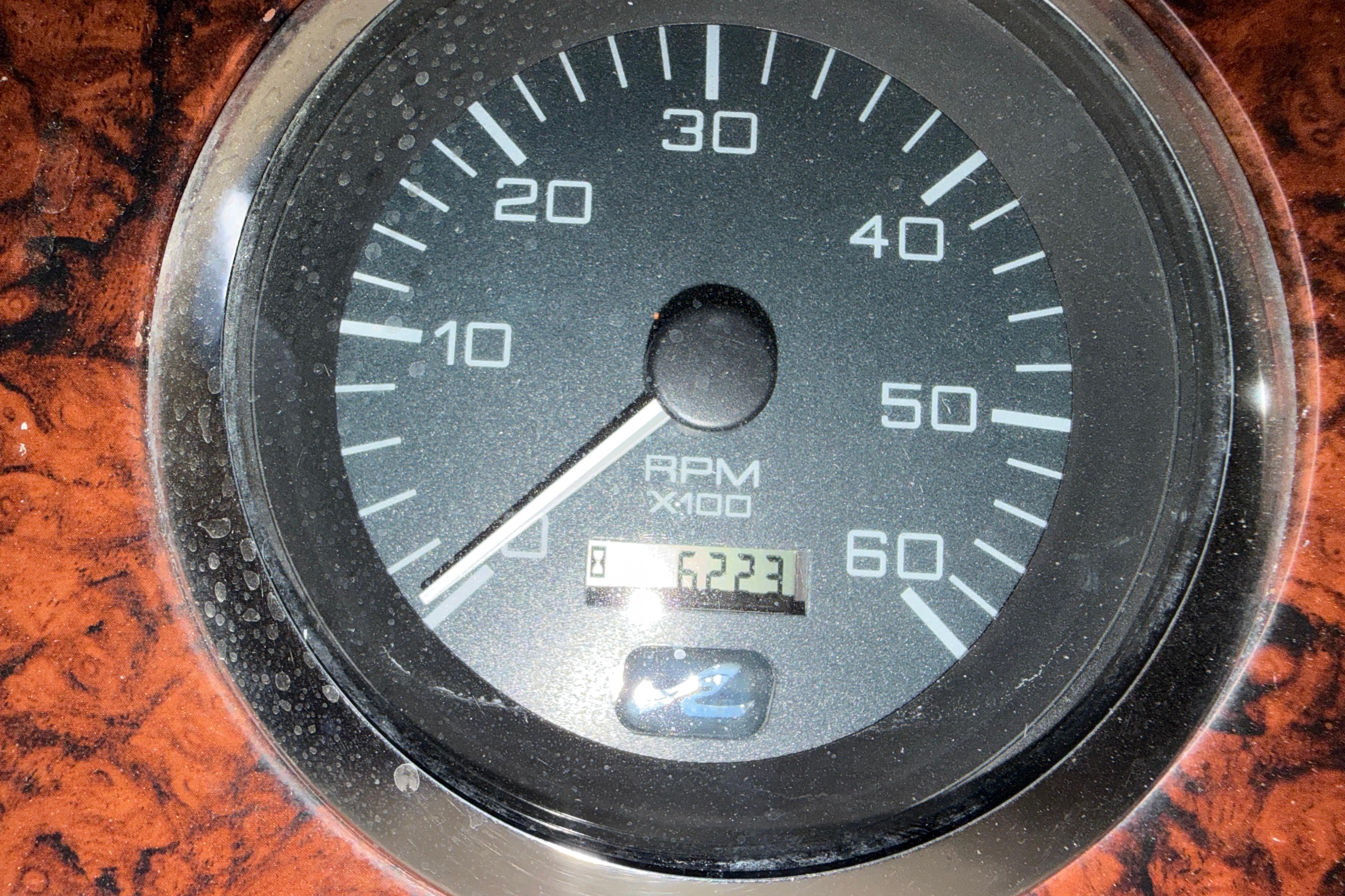 Close-up of a 2002 Sea Ray 360 Sundancer RPM gauge displaying 6223 hours.