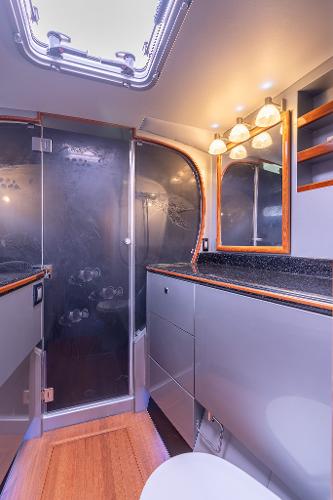 Luxurious bathroom interior of 2025 Shuttleworth 52 AeroRig yacht, featuring modern fixtures and elegant design.