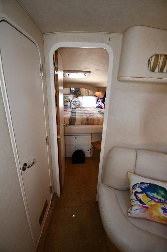 Interior of 1997 Sea Ray 400 Sundancer yacht, featuring cozy cabin and stylish decor.