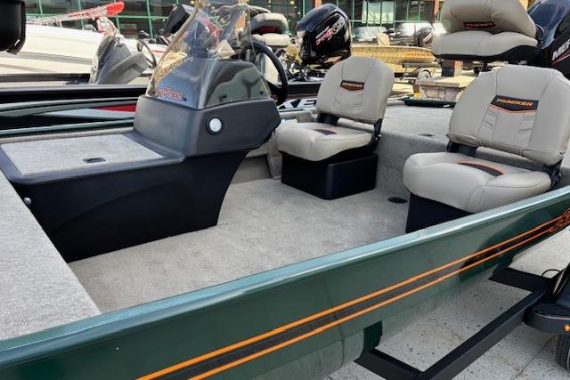 2026 Tracker Bass Tracker Classic Limited boat interior with seating and console, showcasing modern design.