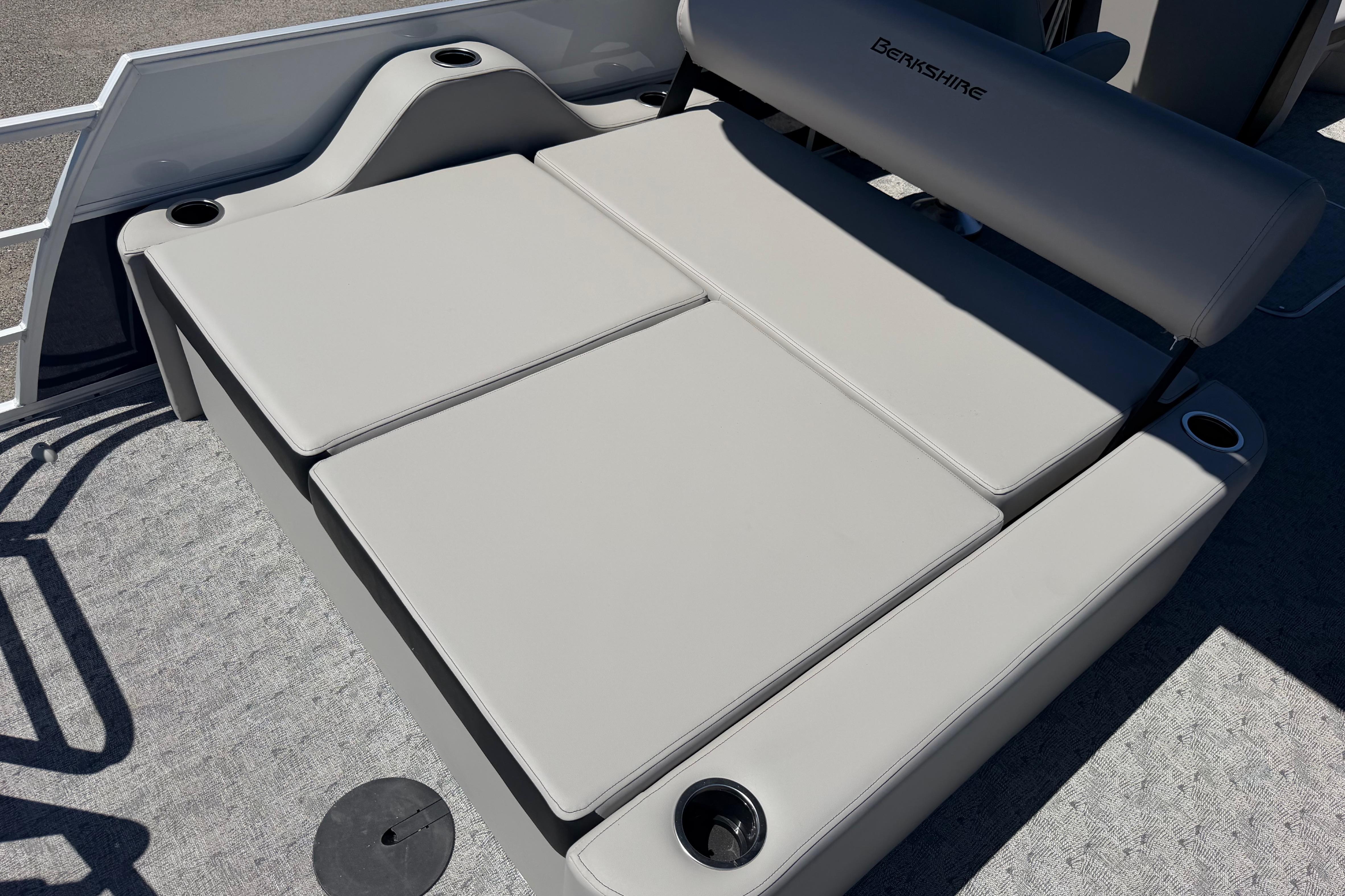 2026 Berkshire LE 24' Ultra Lounger with cup holders and cushioned seating.