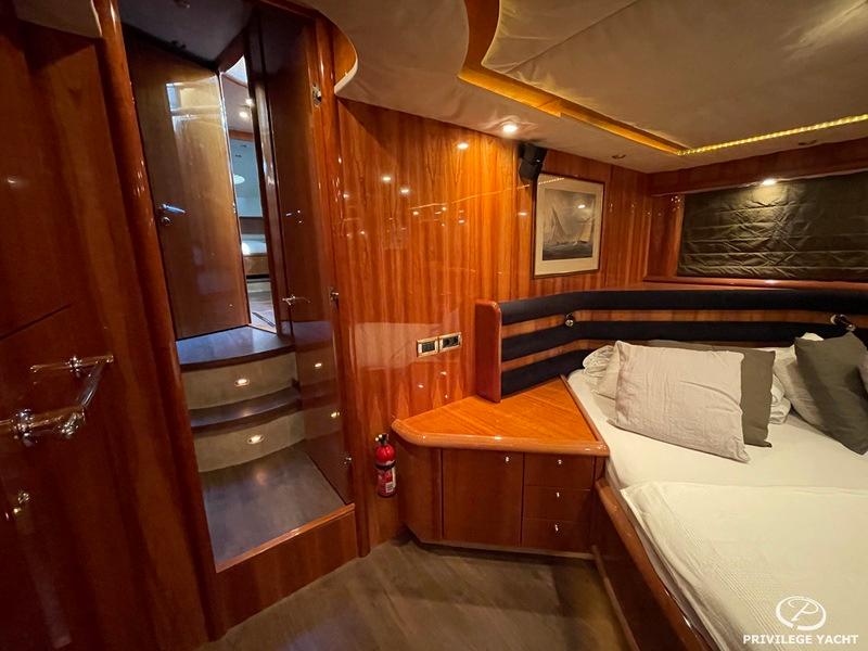 Luxurious cabin interior of 2001 Sunseeker Manhattan 74 yacht with wooden finishes.