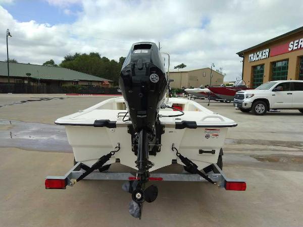 2025 Mako Pro Skiff 13 CC boat on trailer, outdoor dealership setting.