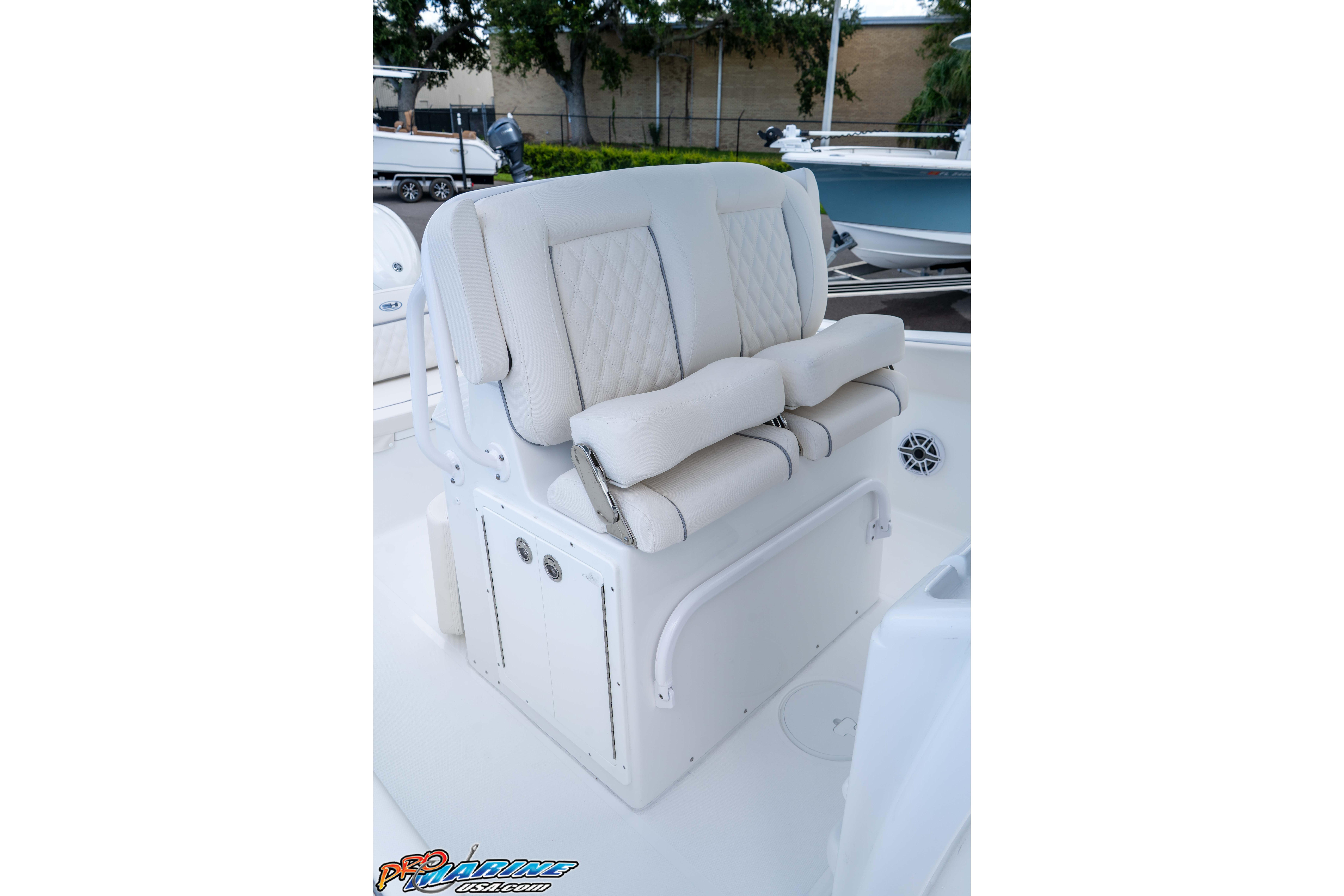 2026 Sea Hunt Ultra 265 SE boat seating with white cushioned upholstery.
