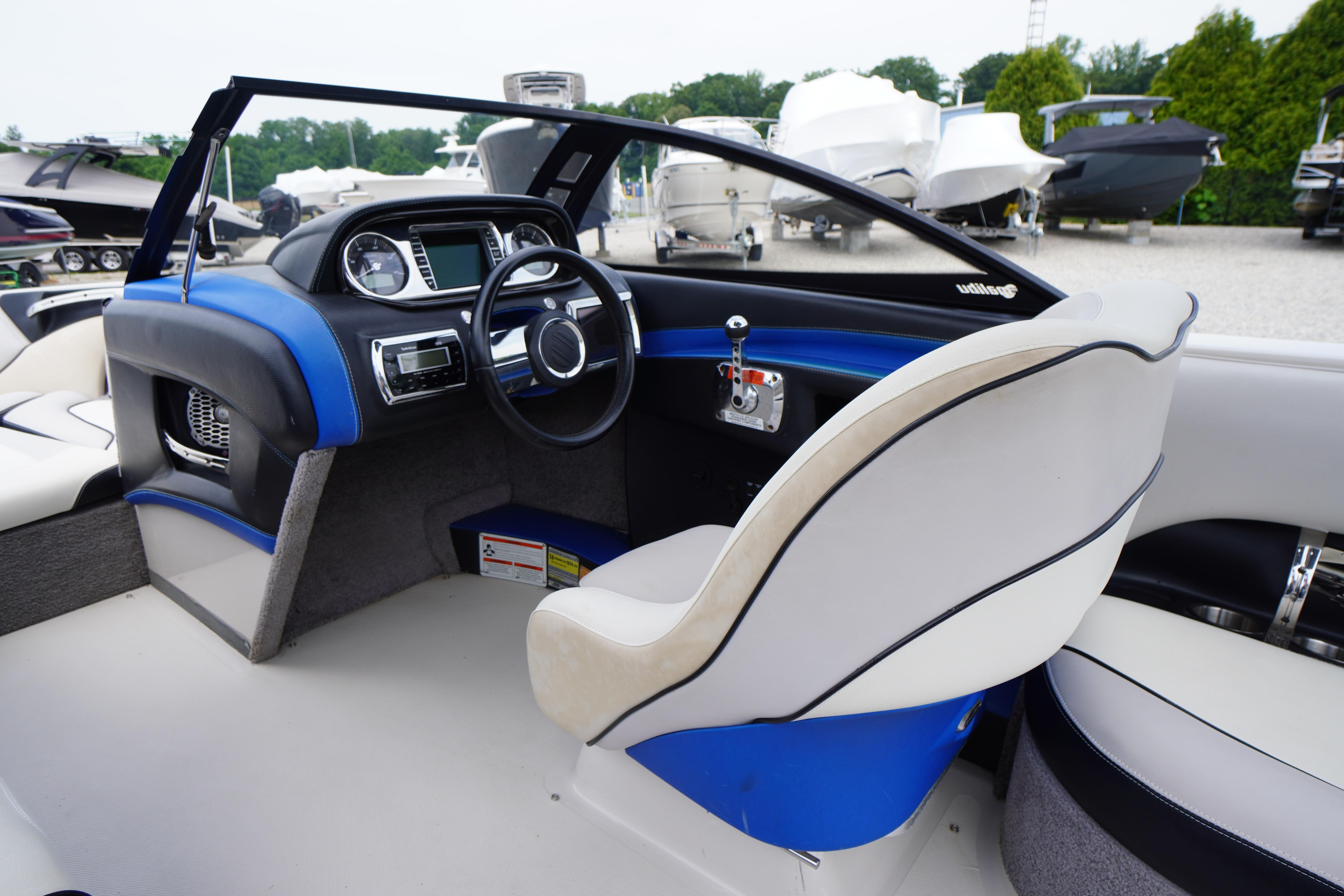 2011 Malibu Wakesetter 21 VLX boat interior with steering wheel and dashboard controls.