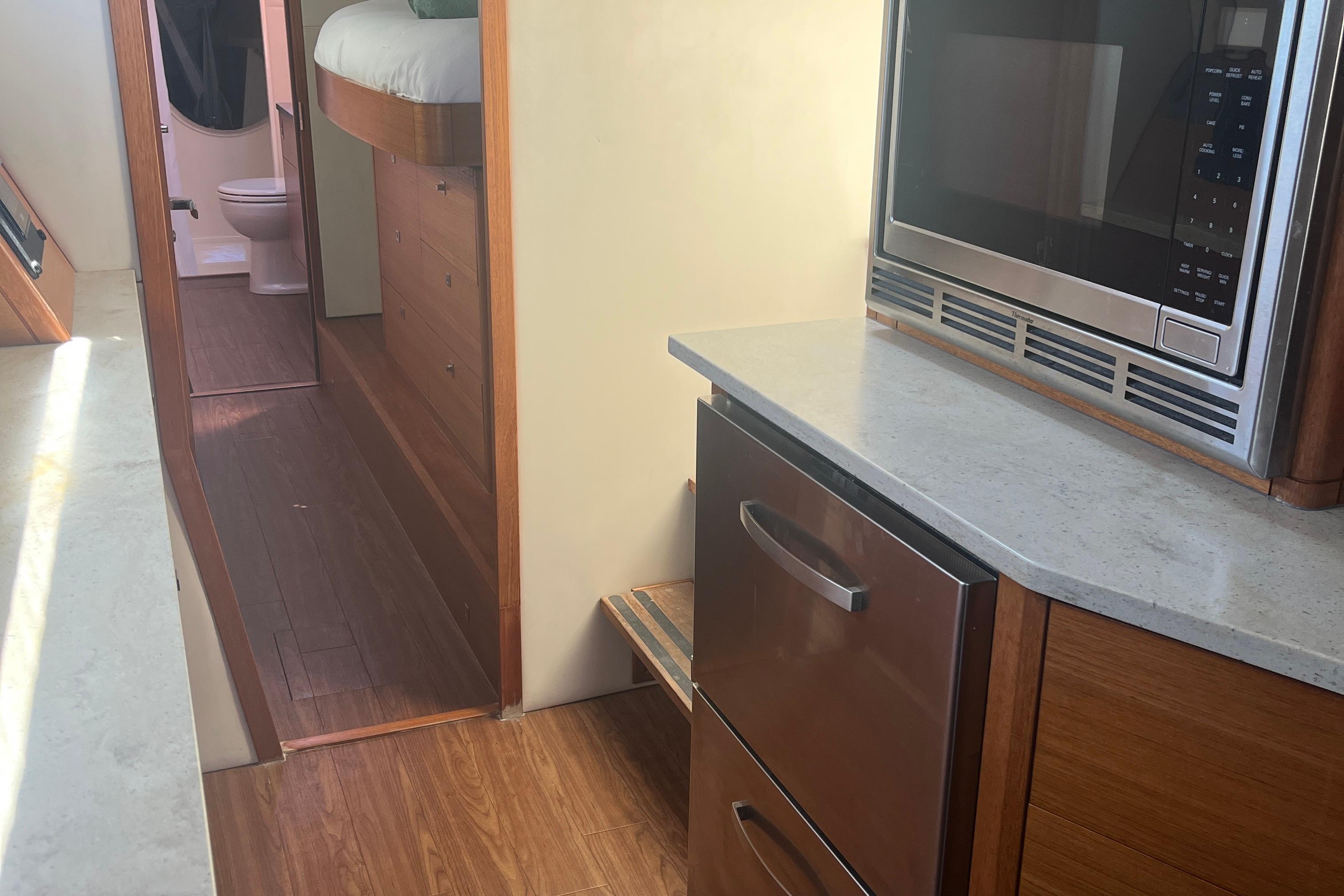 Interior of 2015 Gunboat 57' yacht with modern kitchen and hallway view.
